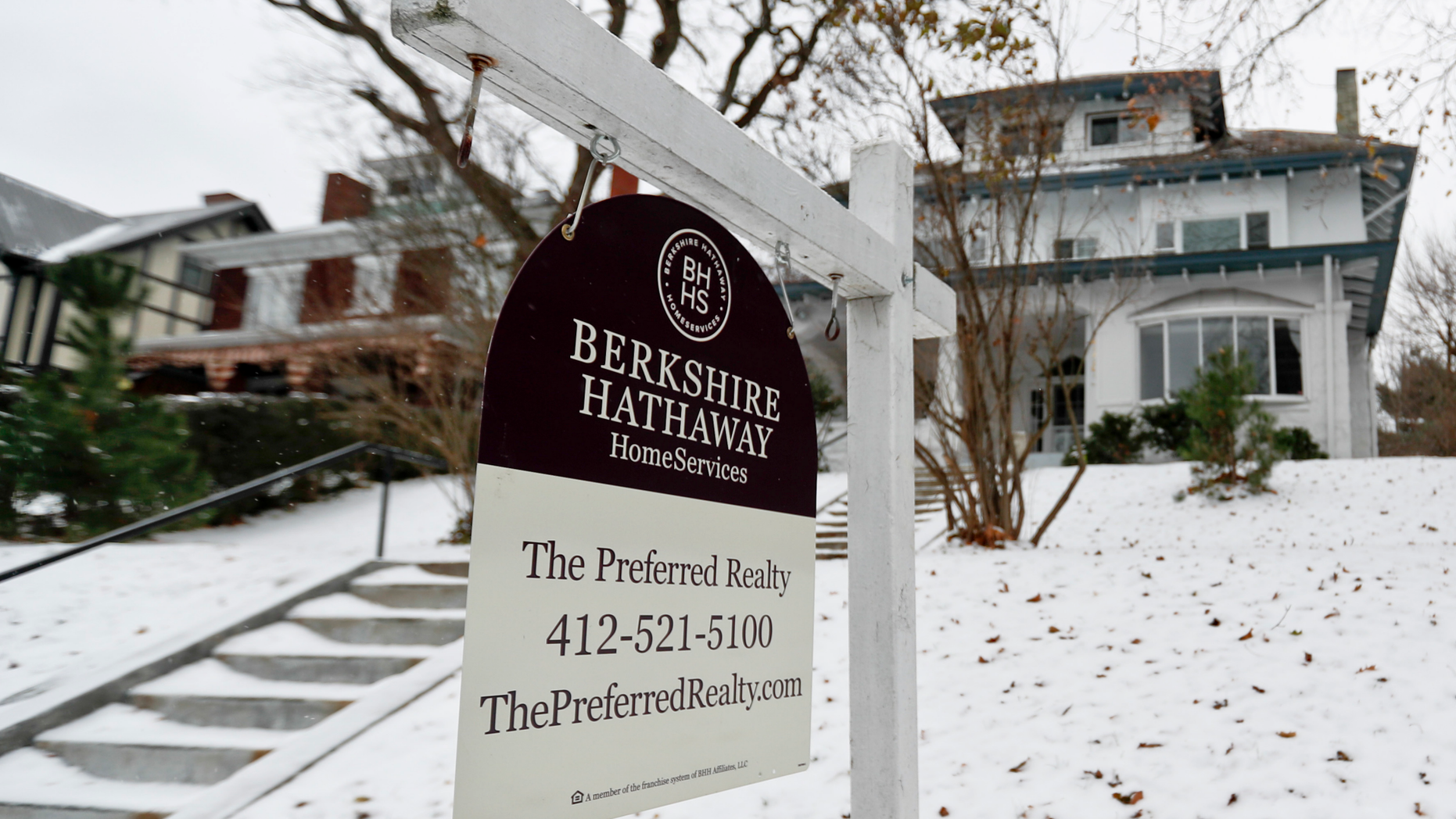 In this Nov. 28, 2018, photo, a realtor sign hangs in front of a home for sale in Pittsburgh. On Thursday, Nov. 29, Freddie Mac reports on the week's average U.S. mortgage rates. (AP Photo/Keith Srakocic)