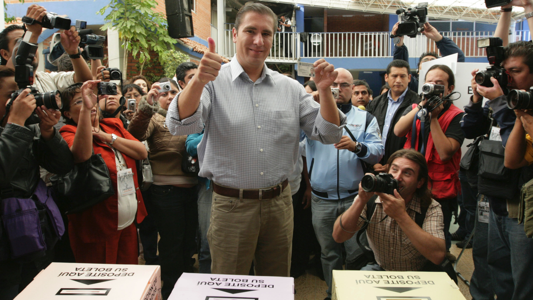 FILE - In this July 4, 2010 file photo, Rafael Moreno Valle, candidate of the "Compromiso por Puebla" party coalition, flashes two thumbs up after casting his vote during state elections in Puebla, Mexico. Moreno Valle, who went on to win the 2010 gubernatorial race, died in what local media are reporting as a helicopter crash on Christmas Eve, Monday, Dec. 24, 2018, along with his wife Martha Erika Alonso, who is currently the governor of Puebla. (AP Photo/Joel Merino, File)
