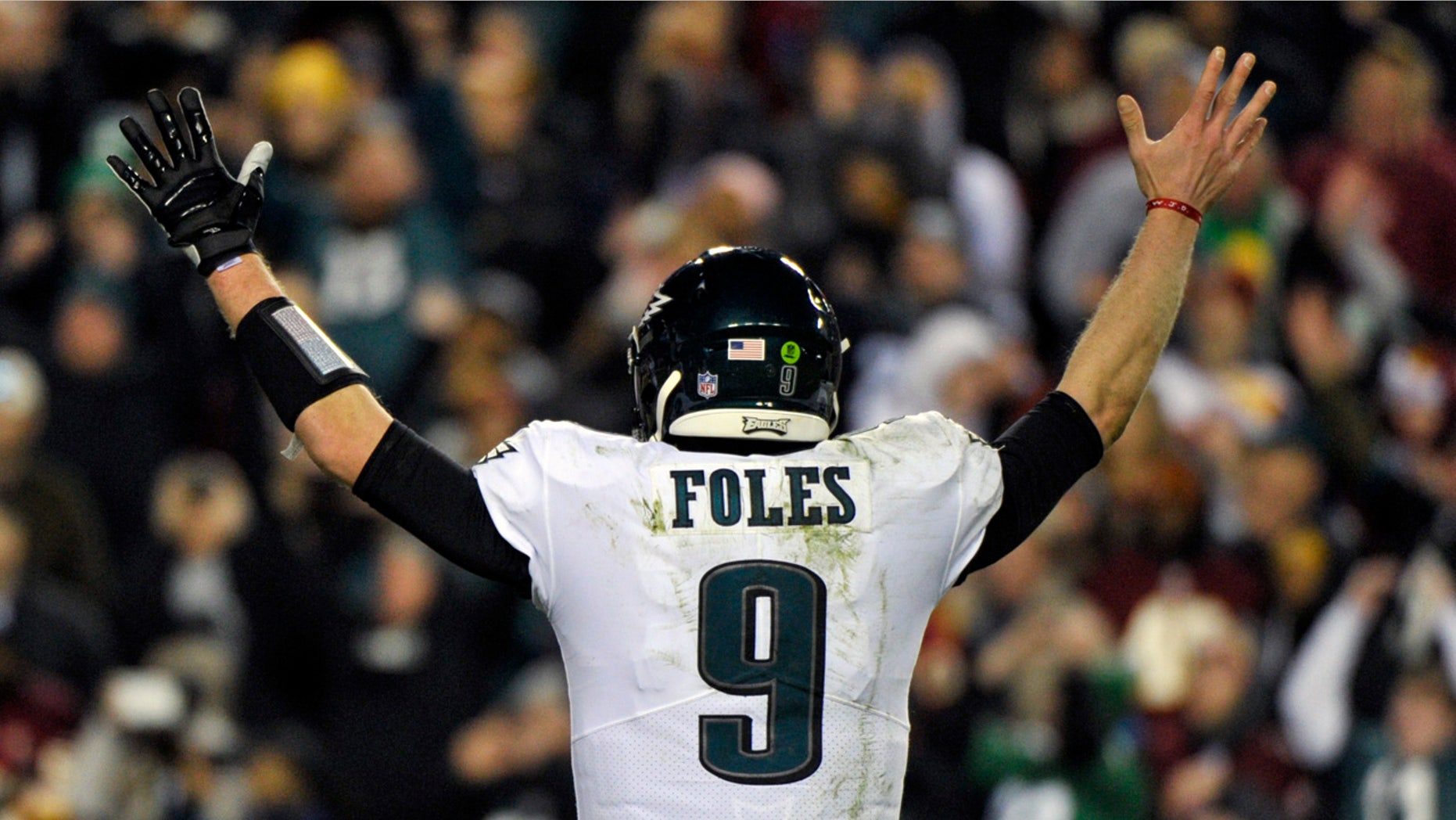 Philadelphia Eagles quarterback Nick Foles (9) reacts to wide receiver Nelson Agholor's touchdown during the second half of the NFL football game against the Washington Redskins, Sunday, Dec. 30, 2018 in Landover, Md. (AP Photo/Mark Tenally)