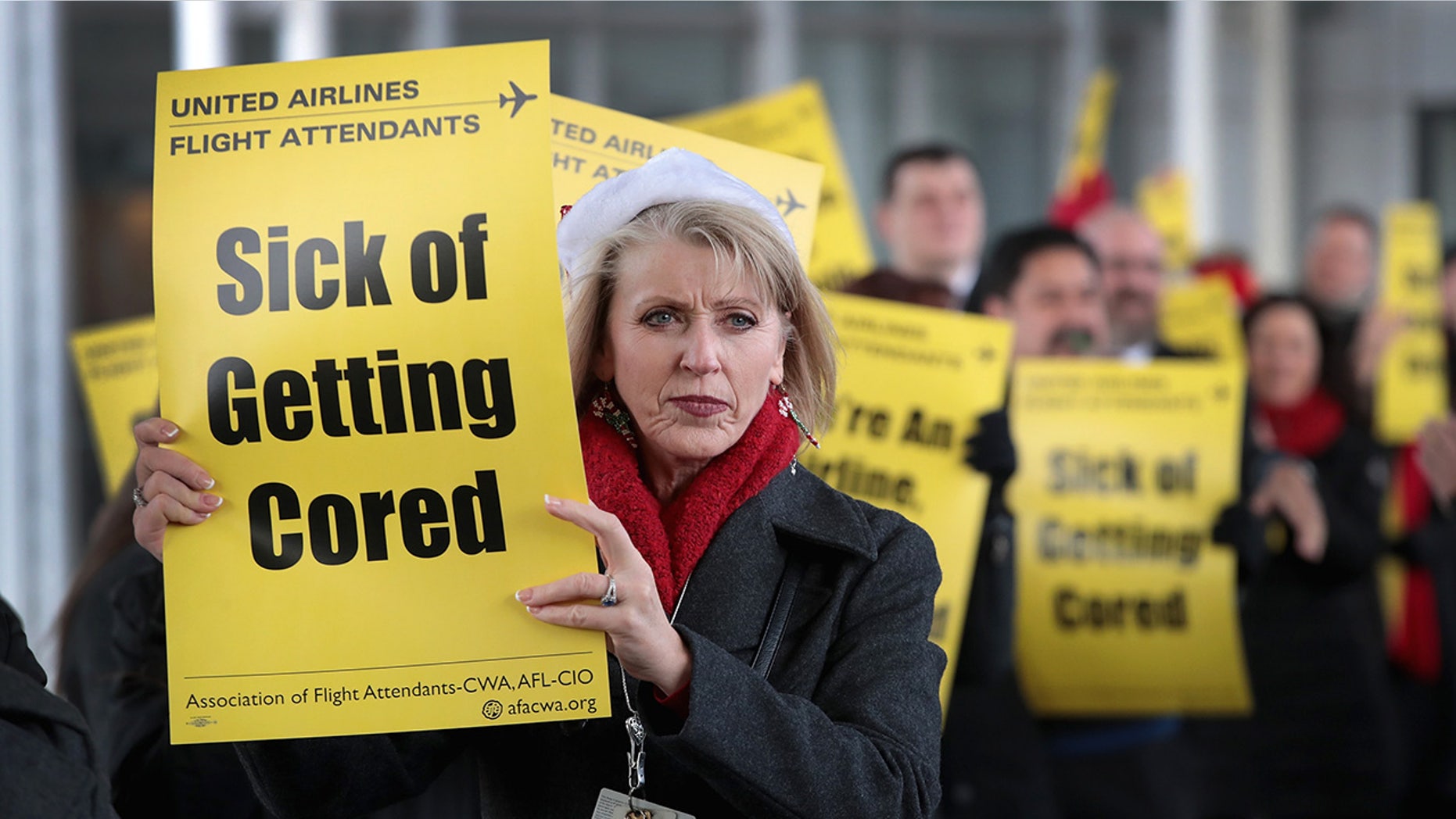 Members of the Association of Flight Attendants-CWA protest United Airlines at O'Hare International Airport on Dec. 13, 2018 in Chicago. (Photo by Scott Olson/Getty Images)