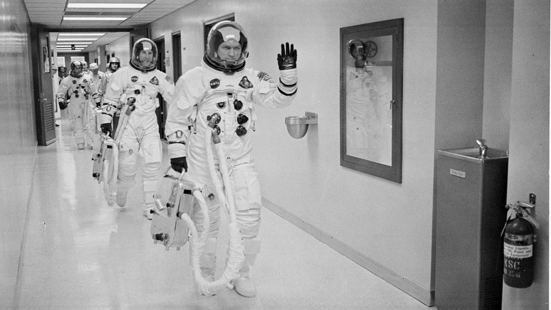 Apollo 8 Commander Colonel Frank Borman leads the way as he, Command Module Pilot Captain Jim Lovell, and Lunar Module Pilot Major Bill Anders head to the launch pad for humanity’s maiden voyage around the moon and its first aboard the Saturn V vehicle.
