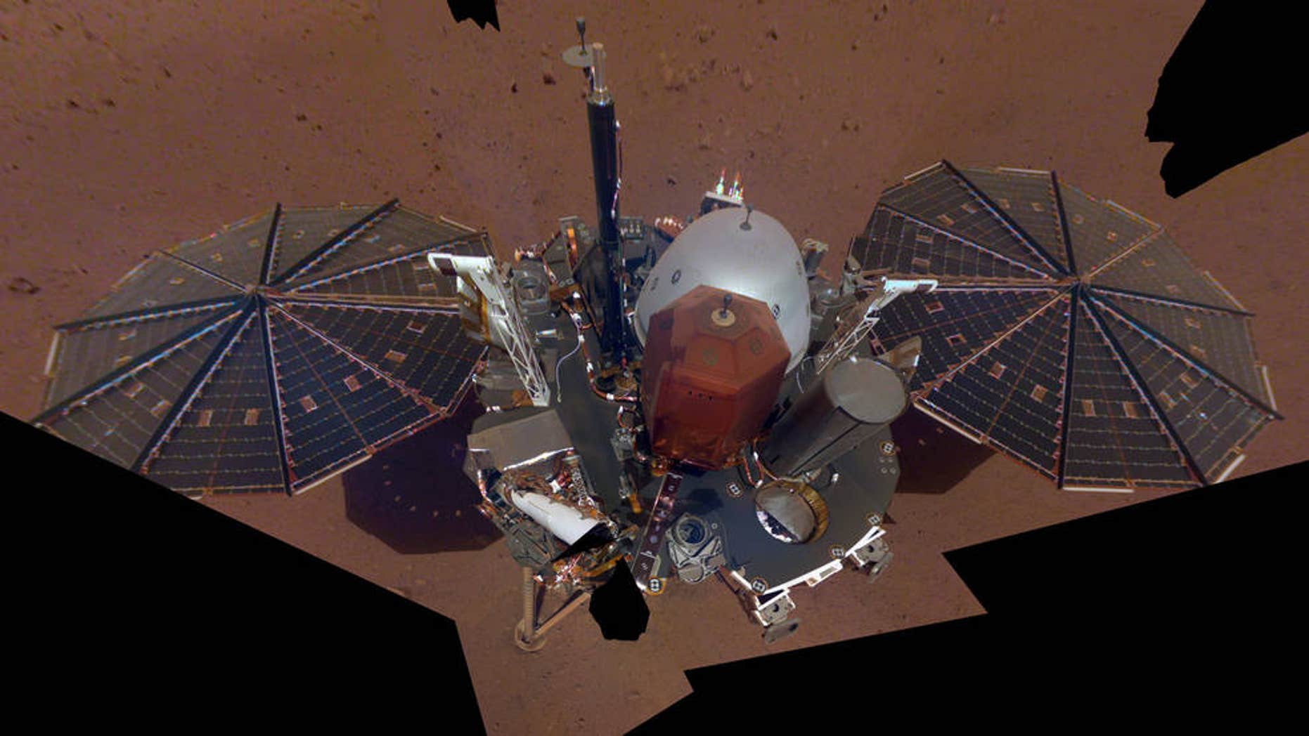 NASA InSight Lander has taken its first selfie on Mars. The "mosaic" is pieced together from 11 images. The selfie was taken on Dec. 6, 2018. (NASA/JPL-Caltech)