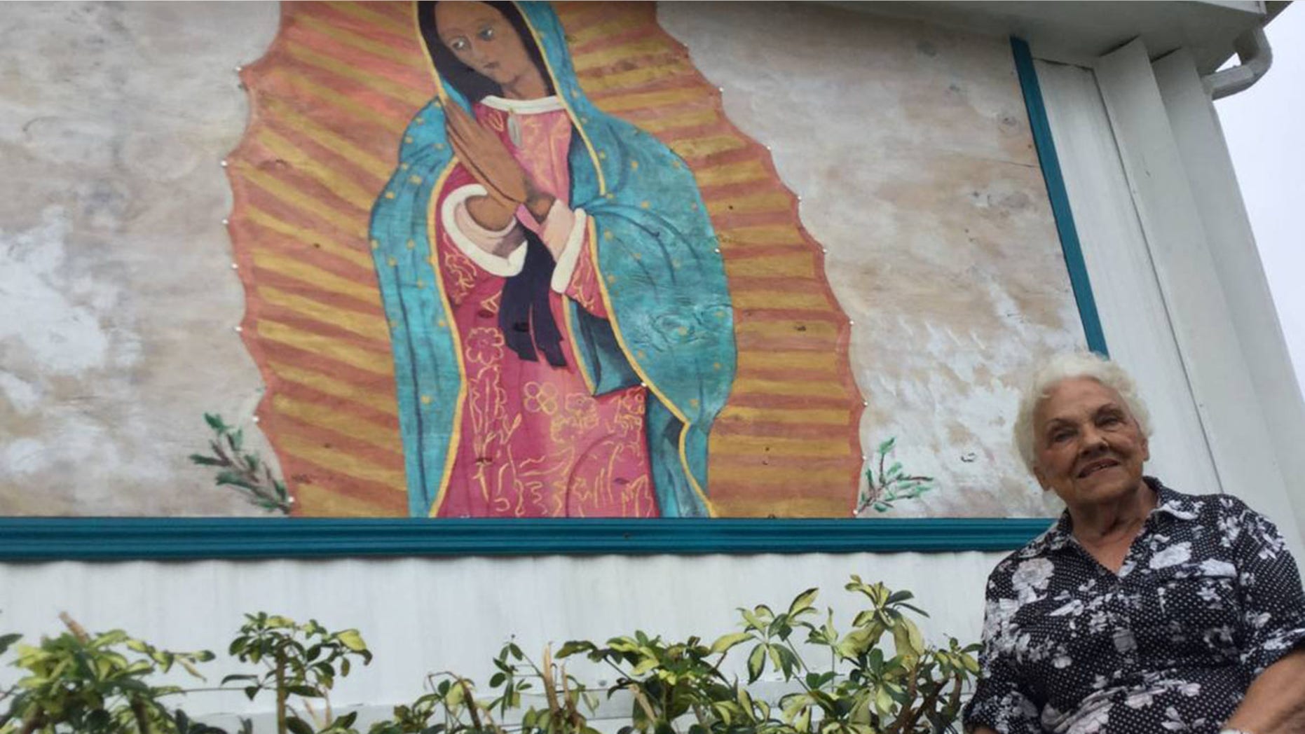 Millie Francis, 85, says she was inspired to paint a picture of the Virgin Mary on a piece of plywood that replaced a window she wanted removed from her mobile home in Bradenton, Florida.