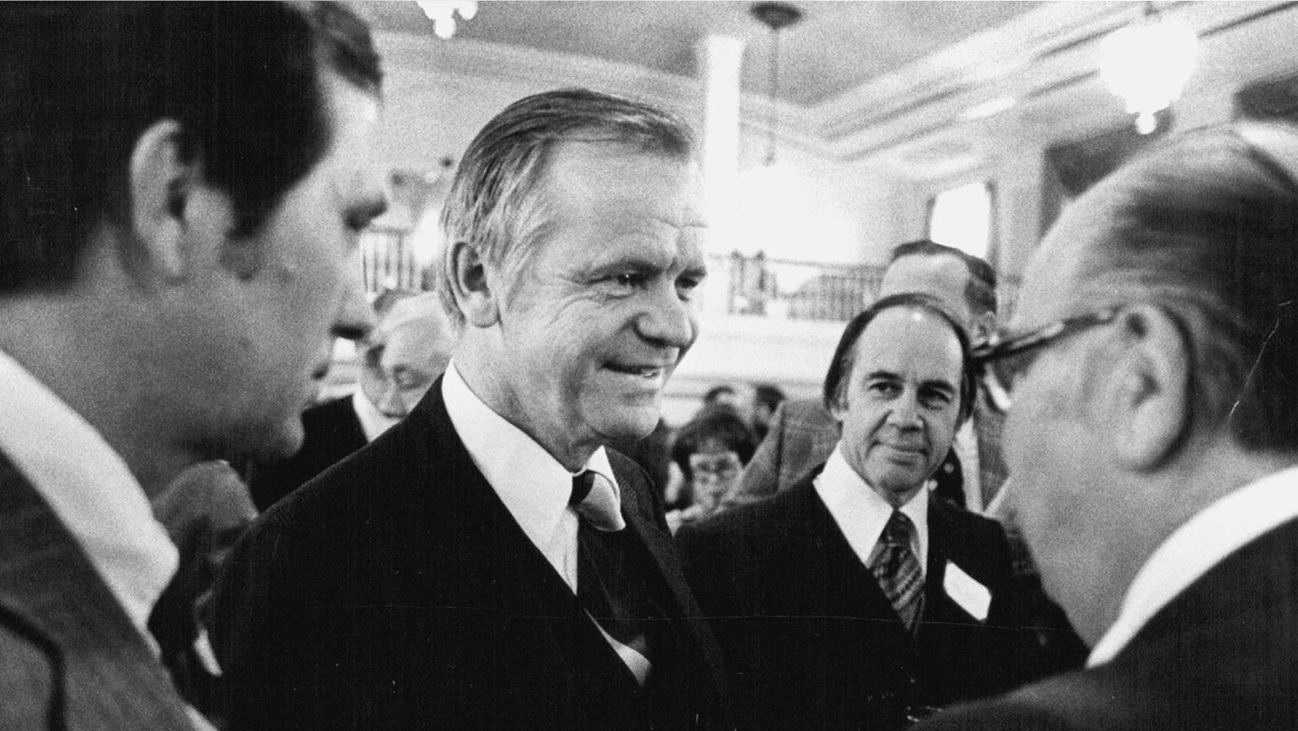 In a January 23, 1977 photo, Agriculture Secretary Bob Bergland, center, talks with guests at a National Press Club reception. (Kent Kobersteen/Star Tribune via AP)
