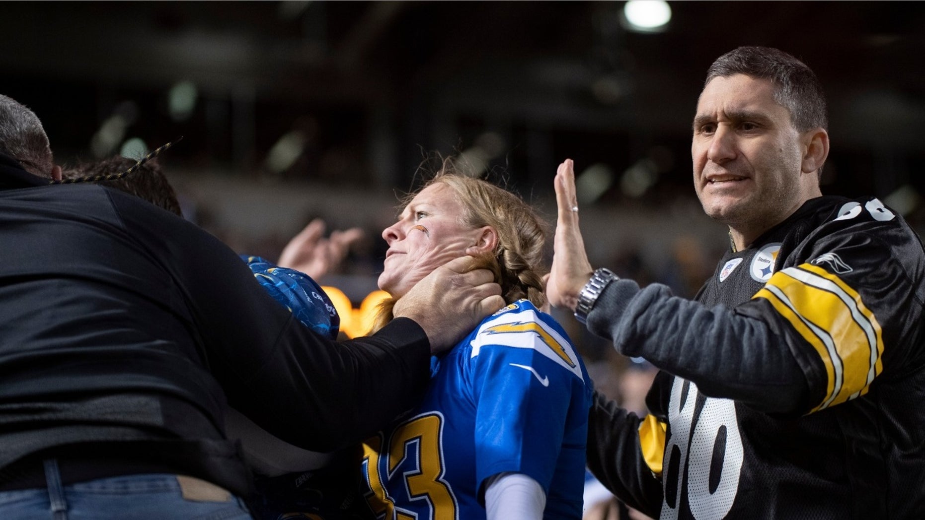 A woman was seen being choked during Sunday's game between the Chargers and Steelers.