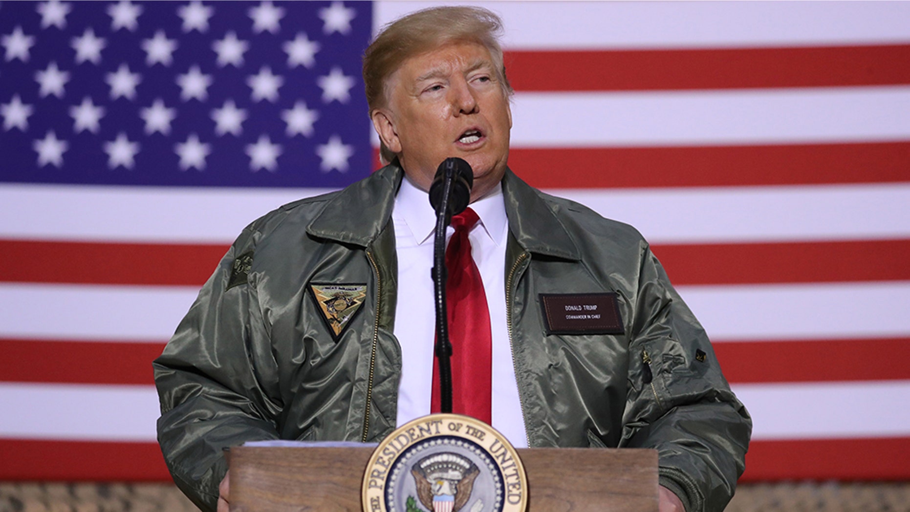 U.S. President Donald Trump delivers remarks to U.S. troops in an unannounced visit to Al Asad Air Base, Iraq December 26, 2018. REUTERS/Jonathan Ernst - RC14496043F0