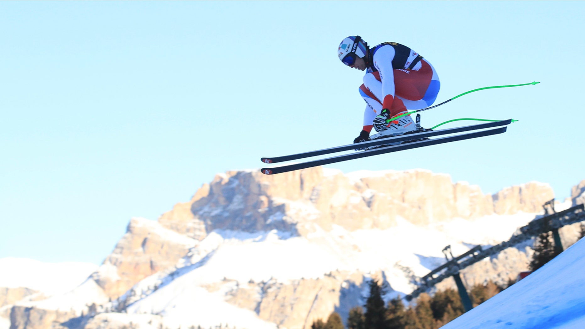Switzerland's Marc Gisin speeds down the course during a men's World Cup downhill, in Val Gardena, Italy, Saturday, Dec. 15, 2018.