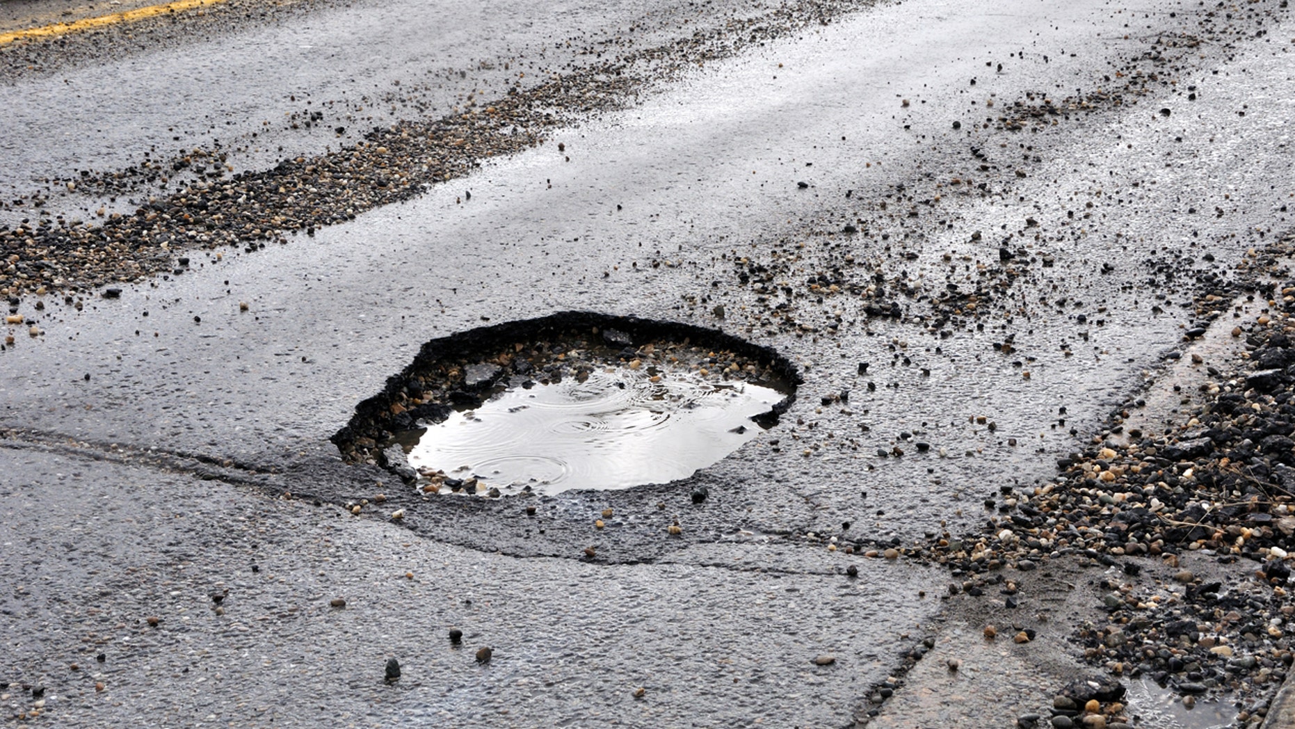 A pothole may now be fixed after residents decided to decorate it for the season.