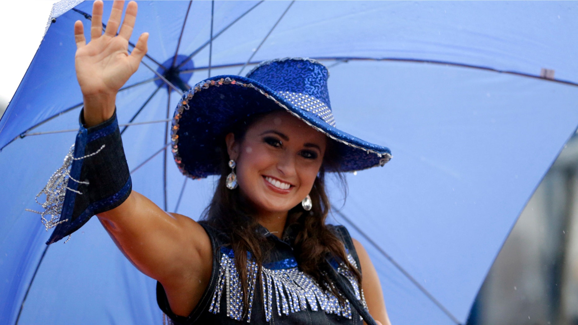 In this Saturday, Sept. 13, 2014 file photo, Miss Kentucky Ramsey Carpenter participates in the Miss America Shoe Parade at the Atlantic City boardwalk in Atlantic City, N.J. (AP Photo/Julio Cortez, File)