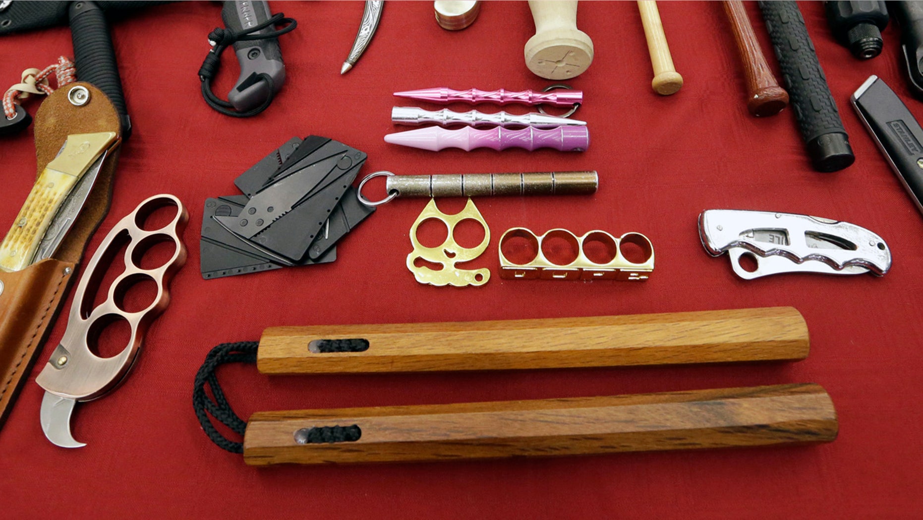 It's now legal to own nunchucks in the state of Arizona. Governor Doug Ducey signed legislation on Friday to remove nunchucks from the list of illigal deadly weapons banned in the state. . (AP Photo/Elaine Thompson)