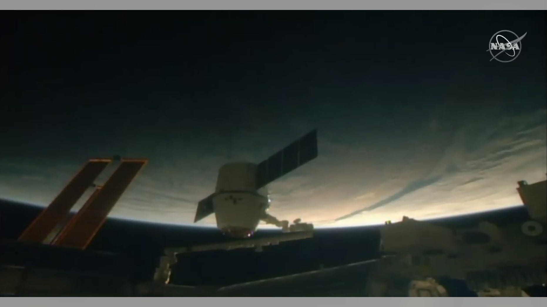 A SpaceX Dragon cargo ship arrives at the International Space Station on Dec. 8, 2018 to deliver 5,600 pounds of supplies for the outpost's Expedition 57 crew. Among that cargo: Christmas cookies, candied yams and green bean casserole.