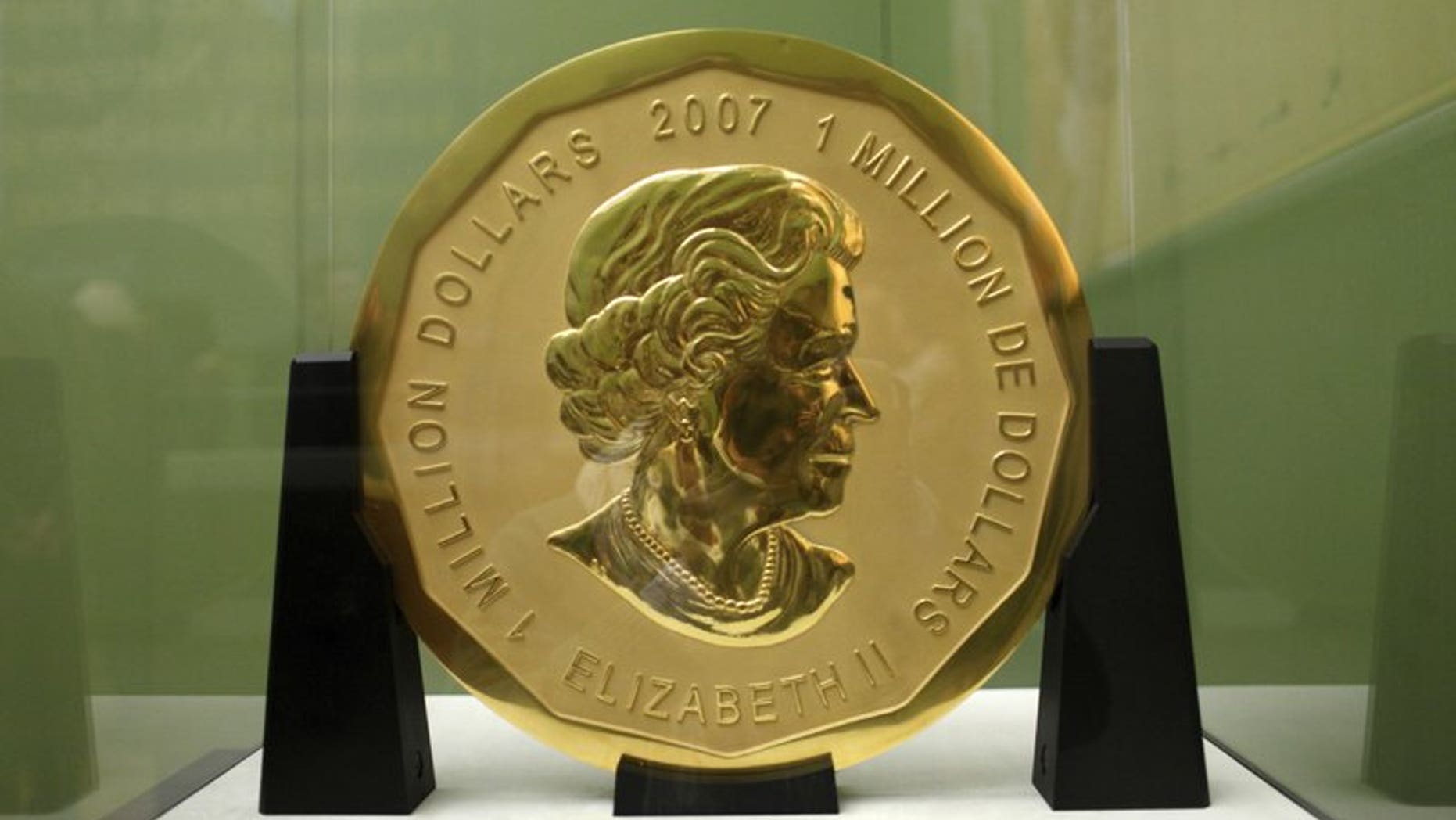 The Dec. 12, 2010 file photo shows the gold coin 'Big Maple Leaf' in the Bode Museum in Berlin. Four young men have gone on trial over the brazen theft of a 221-pound Canadian gold coin from a Berlin museum.