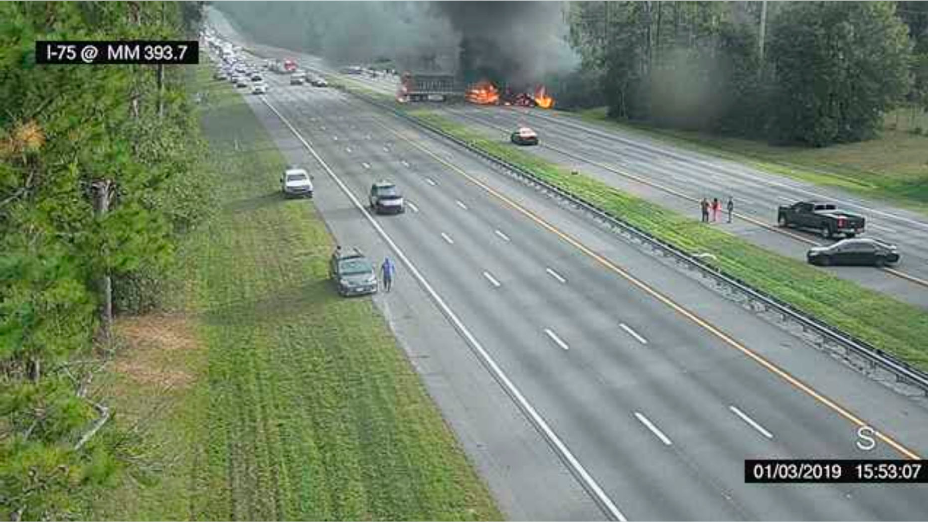 This image taken from a Florida 511 traffic camera and provided by the Alachua County Fire Rescue, shows a fiery crash along Interstate 75, Thursday, Jan. 3, 2019, about a mile south of Alachua, near Gainesville, Fla. Highway officials say six people have died after a crash and diesel fuel spill sparked a massive fire on a Florida interstate. (Alachua County Fire Rescue/Florida 511 via AP)