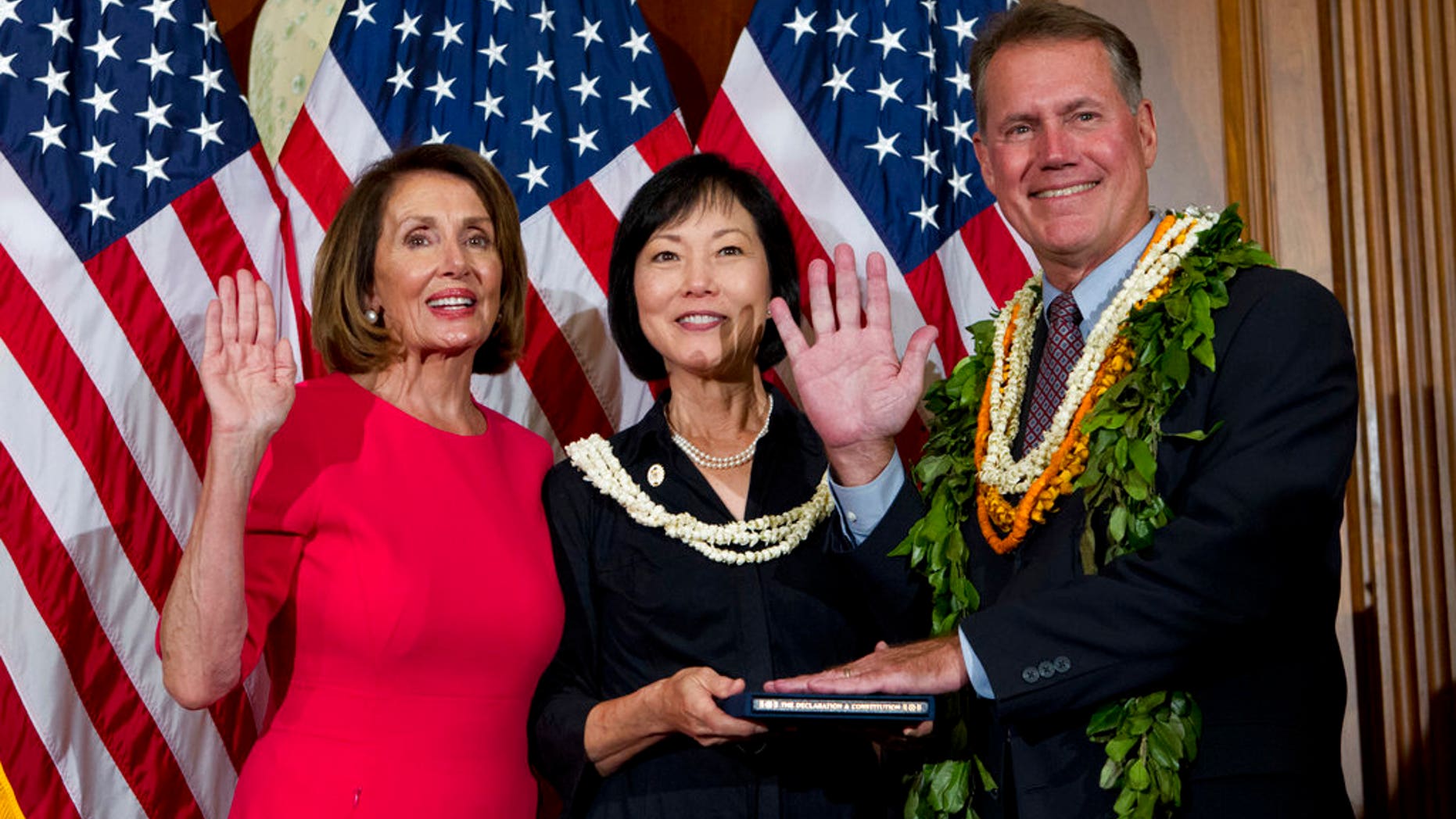 House Speaker Nancy Pelosi of California administers the oath of office to Rep. Ed Case, D-Hawaii, during ceremonial swearing-in on Capitol Hillon Jan. 3. Case attracted criticism this week for saying he feels like an