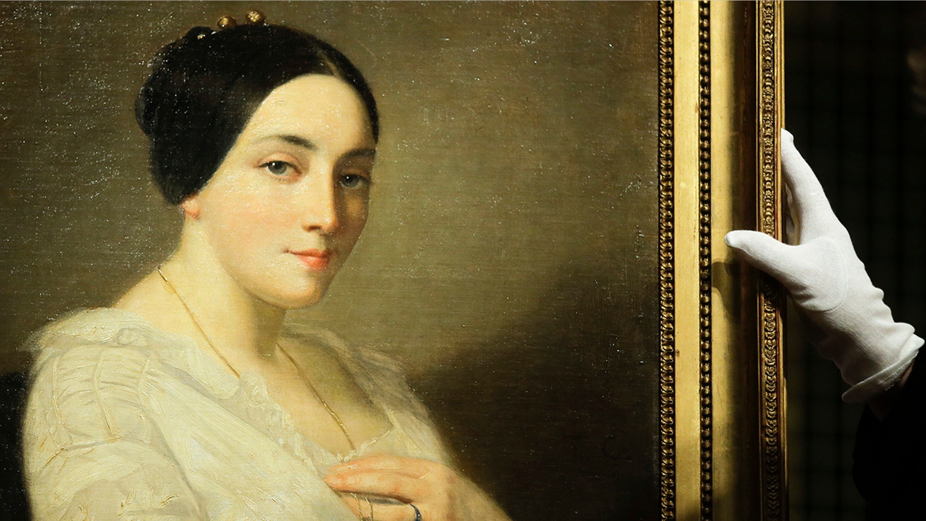 The painting 'Portrait of a Seated Young Woman' by Thomas Couture was discovered in the art trove of late collector Cornelius Gurlitt and belonged to Georges Mandel, a Jewish French politician, and resistance figure who was executed during World War II. (AP Photo/Markus Schreiber)