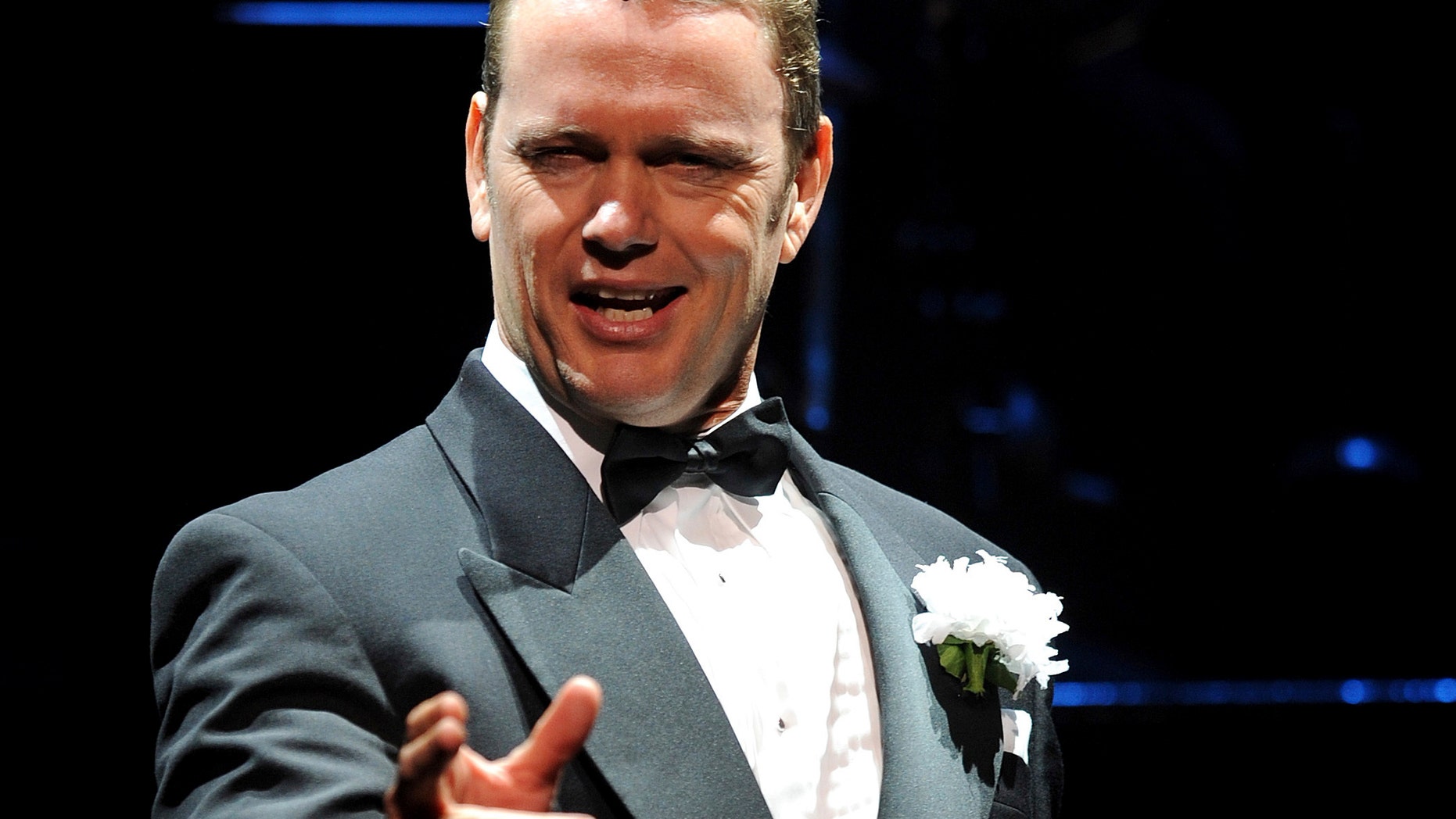 In this May 14, 2009, photo, Craig McLachlan, playing the role of Billy Flynn, performs a number in the latest production of the musical Chicago in Sydney. Australian actor McLachlan has been charged with eight counts of indecent assault, and one count of common assault, after being accused of sexual misconduct by three women who worked with him in a stage musical.