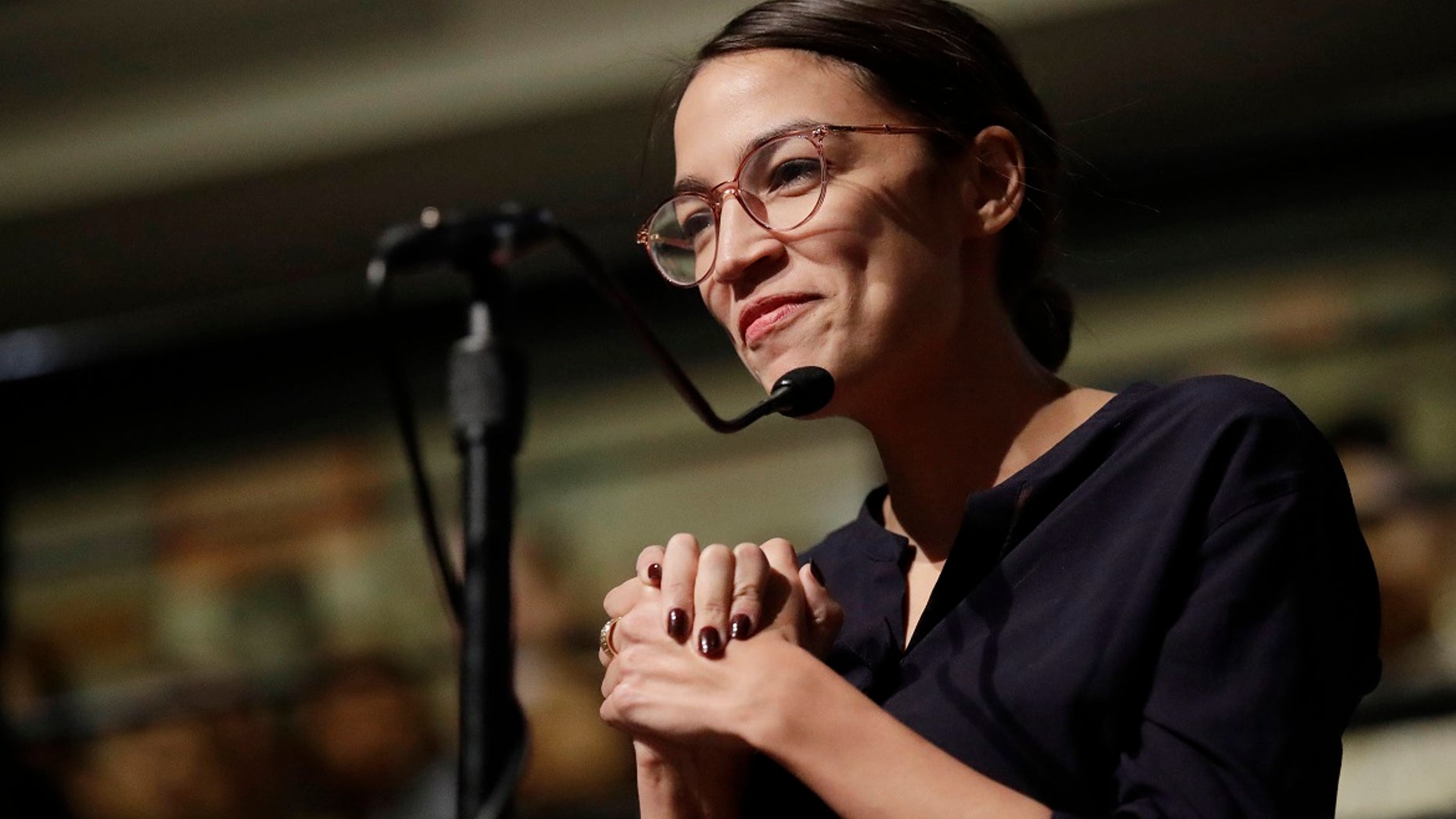 U.S. Rep.-elect Alexandria Ocasio-Cortez, D-N.Y., asks 2014 Nobel Laureate Malala Yousafzai a question at the Kennedy School's Institute of Politics at Harvard University in Cambridge, Mass., Dec. 6, 2018. (Associated Press)