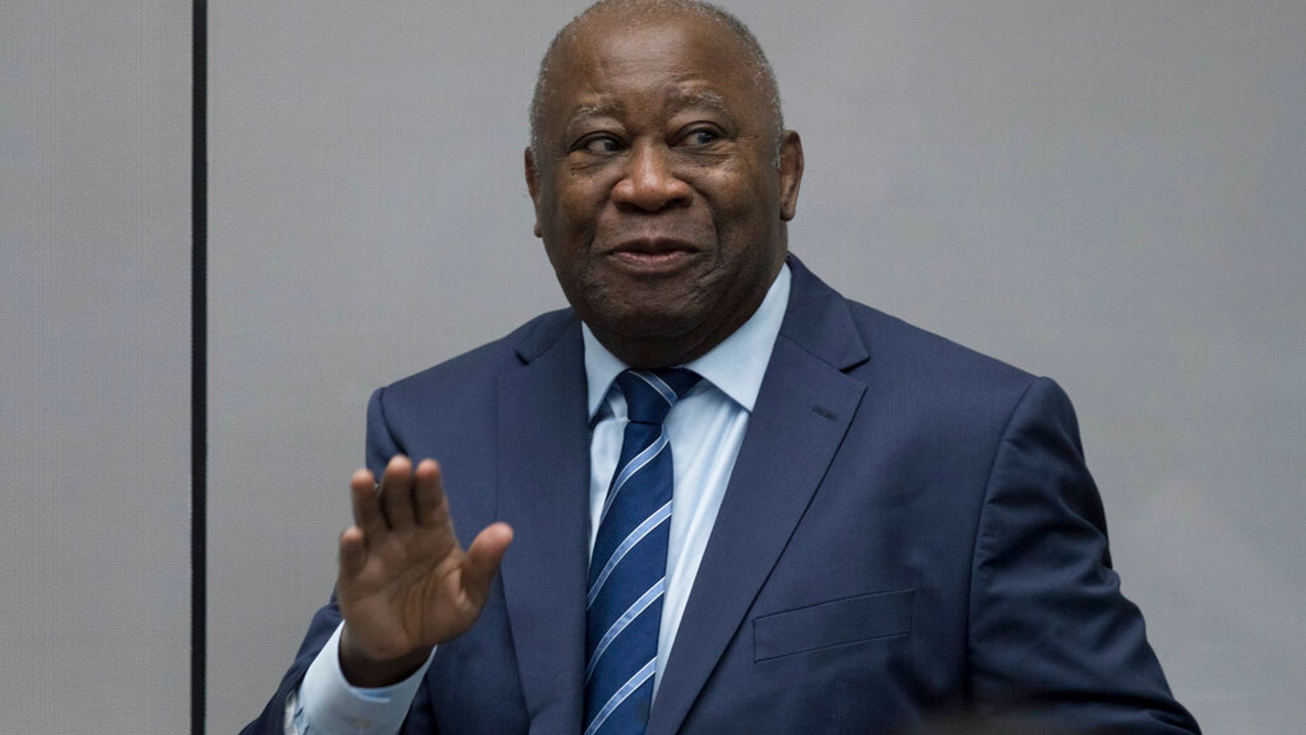 Former Ivory Coast President Laurent Gbagbo enters the courtroom of the International Criminal Court in The Hague, Netherlands, Tuesday, Jan. 15, 2019