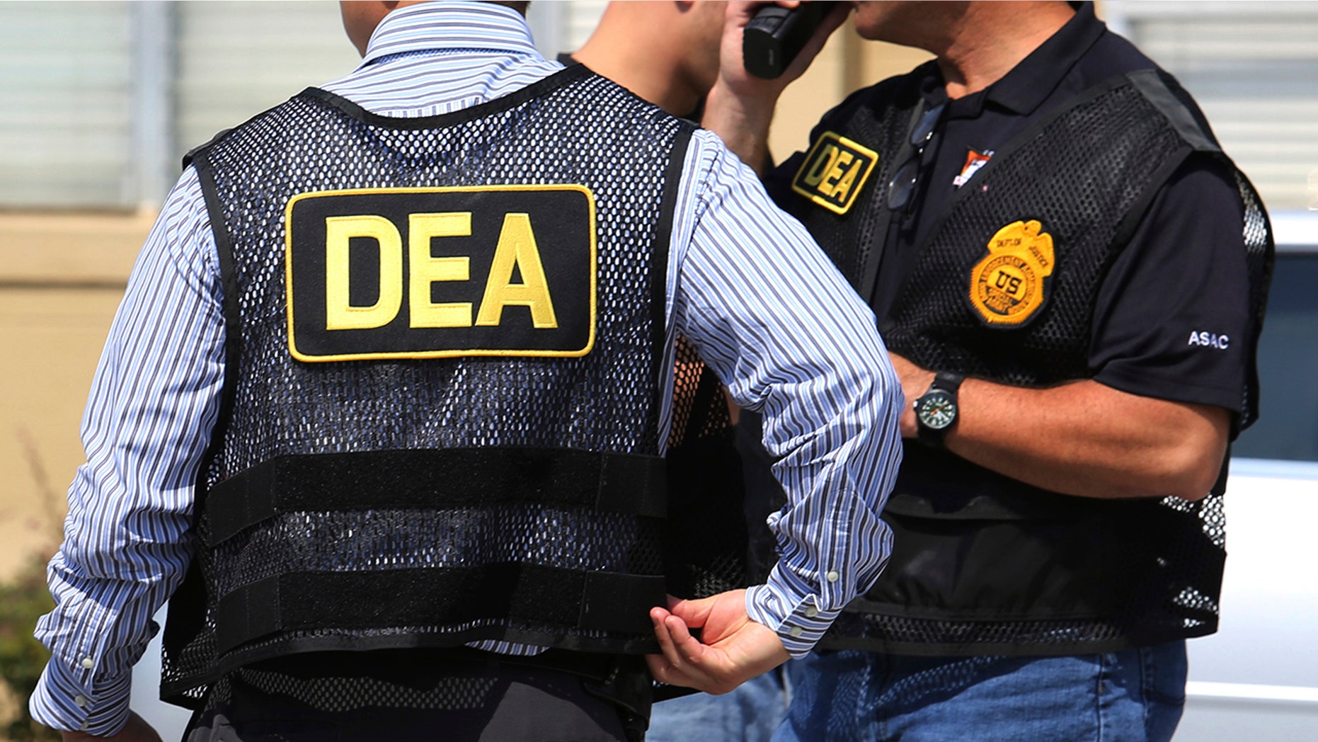 FILE - In this June 13, 2016, file photo, Drug Enforcement Administration (DEA) agents arrive on the scene of a fatal shooting in Florida. U.S. federal narcotics agent, Jose Irizarry, is accused of conspiring with a longtime DEA informant to launder more than $7 million in illicit drug proceeds from the U.S. to traffickers in Colombia, according to several current and former law enforcement officials. (Joe Burbank/Orlando Sentinel via AP, File)