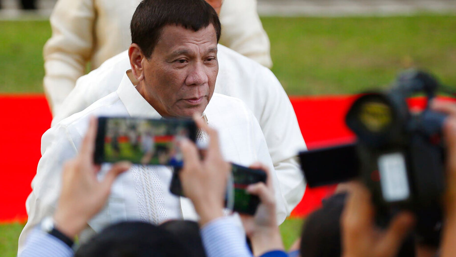 Philippine President Rodrigo Duterte talks to the media prior to a welcome ceremony for visiting Sri Lankan President Maithripala Sirisena Wednesday, Jan. 16, 2019, at the Presidential Palace grounds in Manila, Philippines.