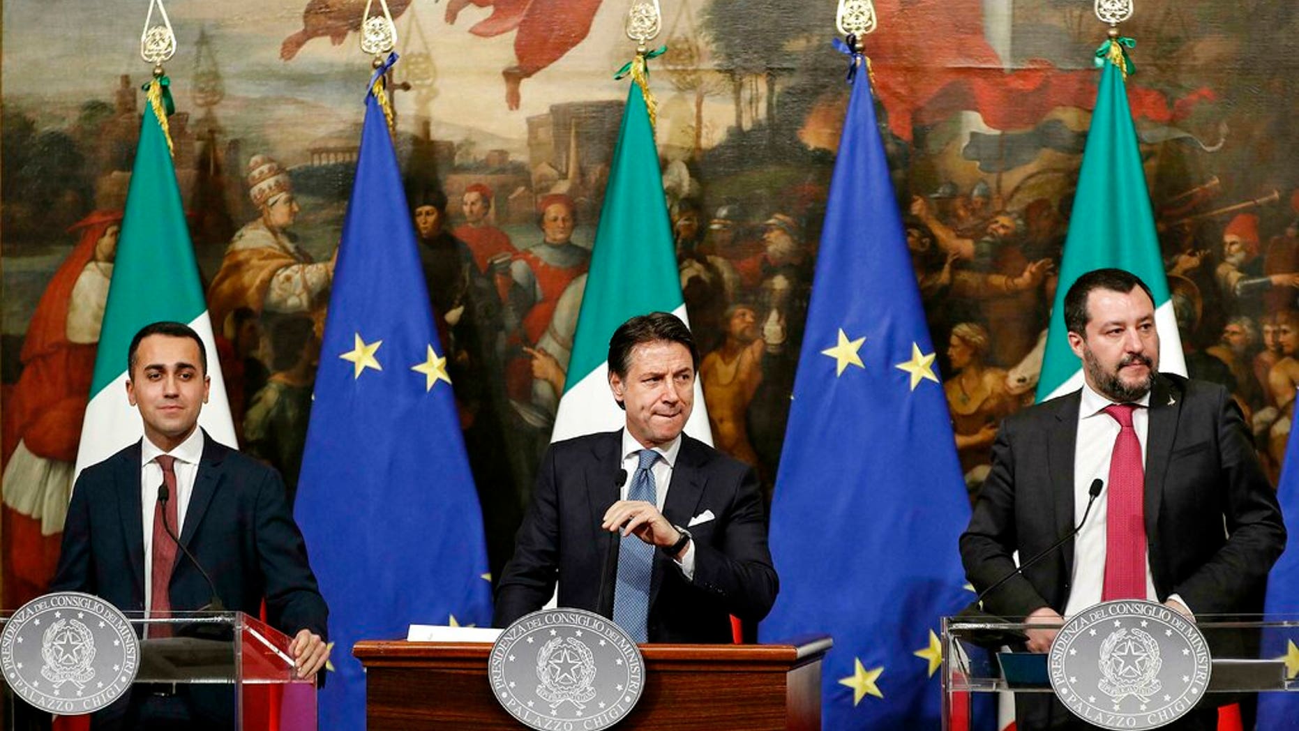 Italian Premier Giuseppe Conte, center, Deputy Premier and Labour and Industry Minister Luigi Di Maio, left, and Deputy Premier and Interior Minister, Matteo Salvini, attend a press conference following a Cabinet meeting at Chigi Palace's premier office in Rome, Thursday, Jan. 17, 2019.