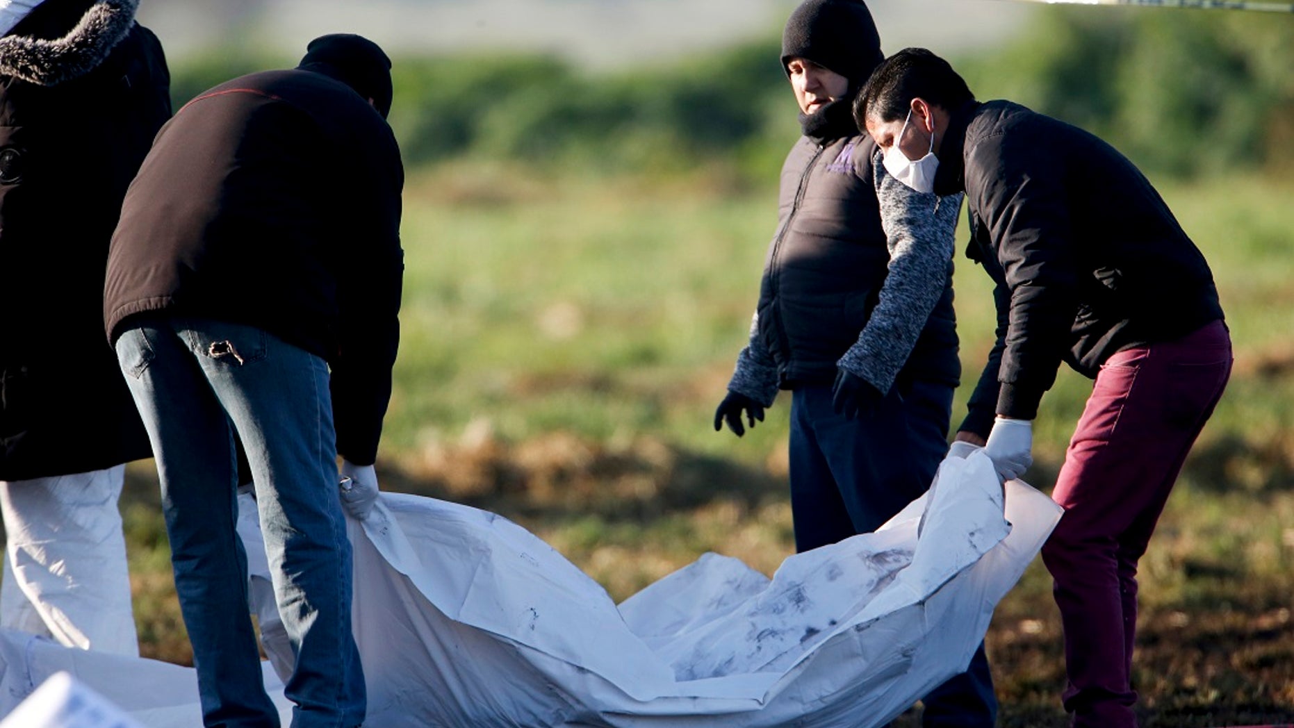 Forensic experts working in the area an oil pipeline explosion in Tlahuelilpan, Hidalgo state, Mexico, Saturday, Jan. 19, 2019. (Associated Press)