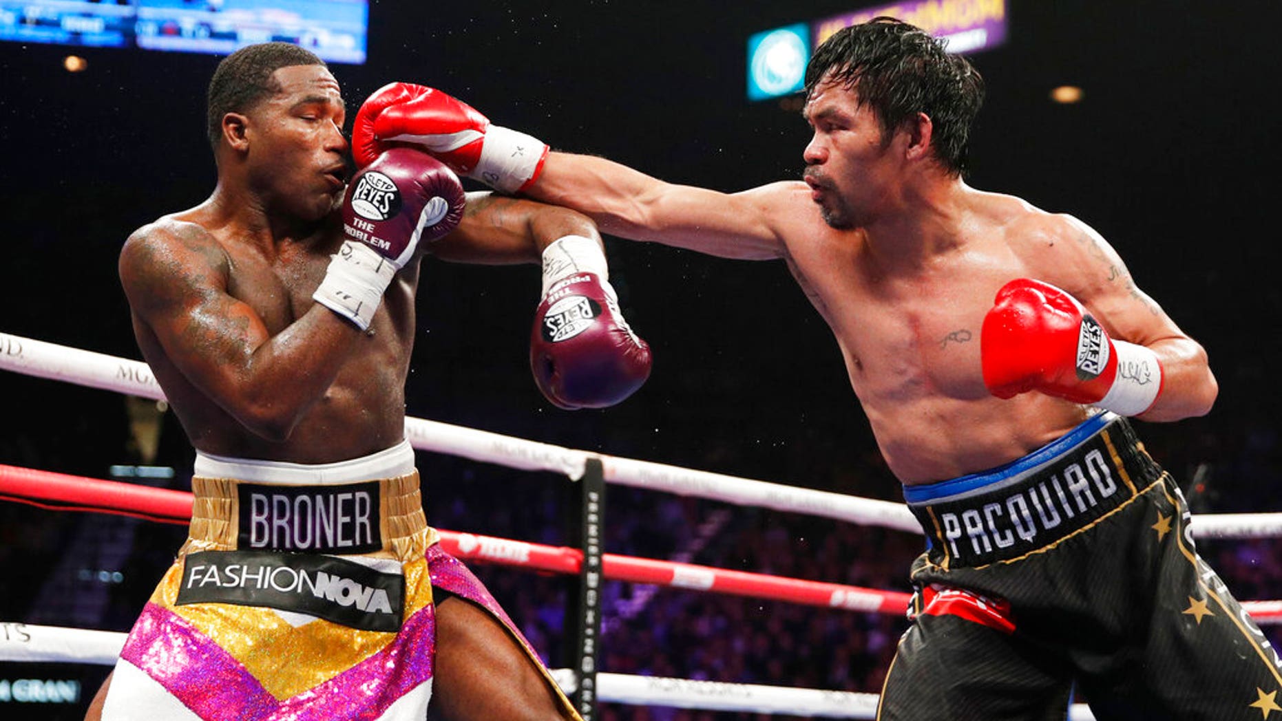 Manny Pacquiao, right, fights Adrien Broner in a welterweight championship bout in Las Vegas.