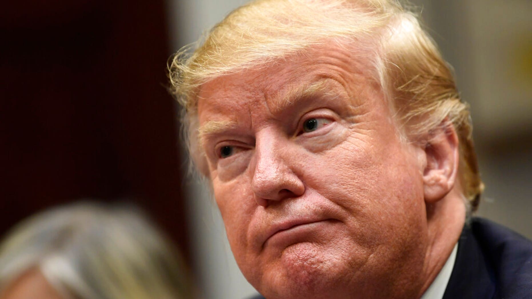 President Trump listens to a meeting with Hispanic pastors in the Roosevelt Room of the White House in Washington last week. (AP Photo / Susan Walsh)
