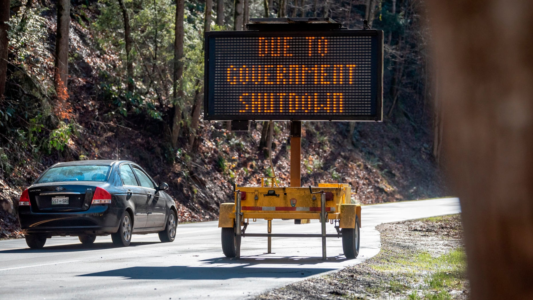 In this Saturday, Jan. 5, 2019, photo visitors to Great Smoky Mountain National Park drive through the park but facilities like the Sugarlands and Cades Cove visitor centers in Townsend, Tenn. The National Park Service said it was working on reopening all of its parks as quickly as possible, but some parks may not open immediately depending on their staff size and complexity. The Virgin Islands National Park, Cape Hatteras National Seashore, the Wright Brothers National Memorial and the Great Smoky Mountains National Park were among the parks that reopened Saturday, Jan. 26, 2019. Grand Canyon National Park issued a statement saying it would be fully operational this week.
