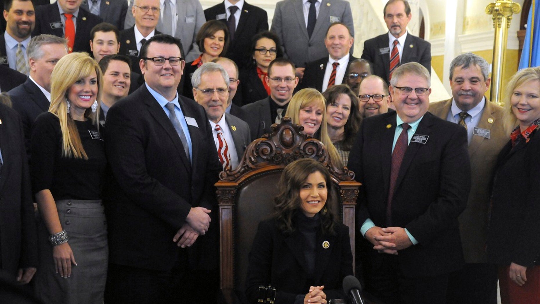 Gov. Kristi Noem smiles after signing her first bill into law at the state Capitol in Pierre, S.D., Thursday, Jan. 31, 2019. The measure allows people to carry concealed pistols without a permit in the state. (Associated Press)