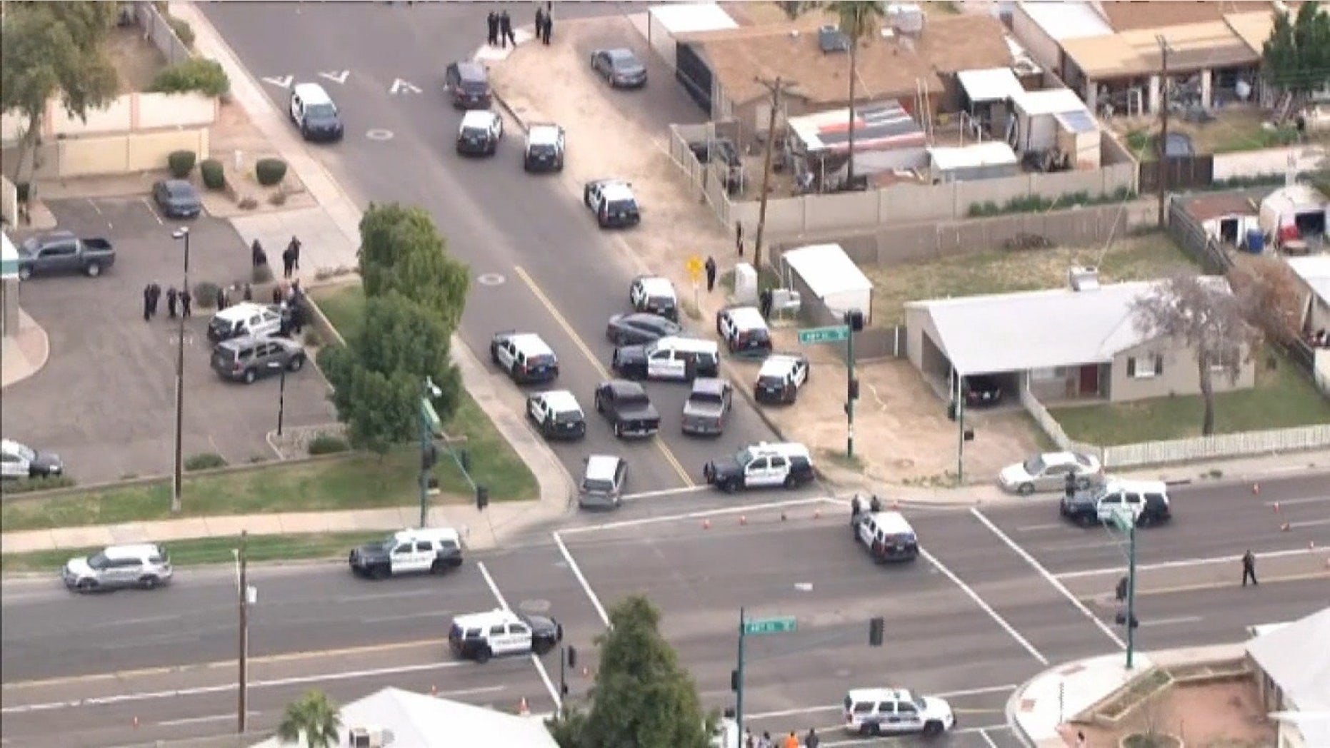 A burglary suspect shot to death by an officer Tuesday was a 14-year-old boy carrying a replica gun, police in Arizona said.
