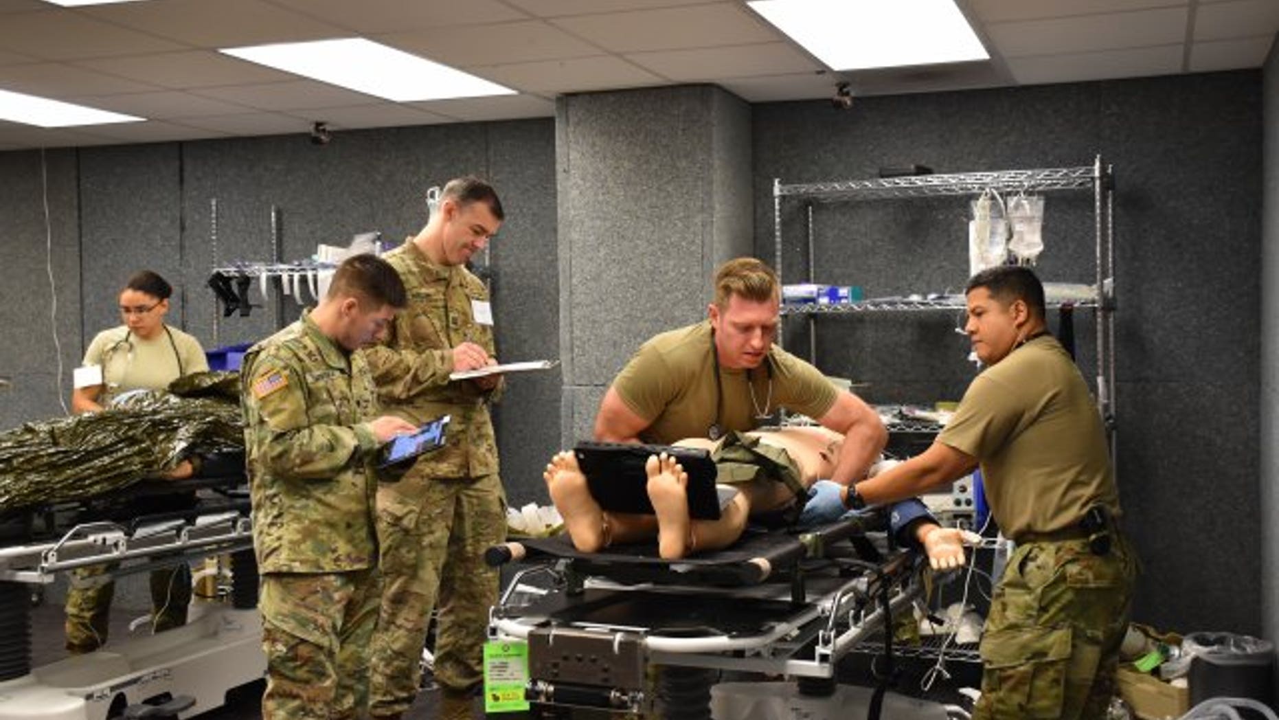 Army Cpt. Sean McCoy, 541st Forward Surgical Team ER physician, conducted patient evaluations on each injured soldier during training .