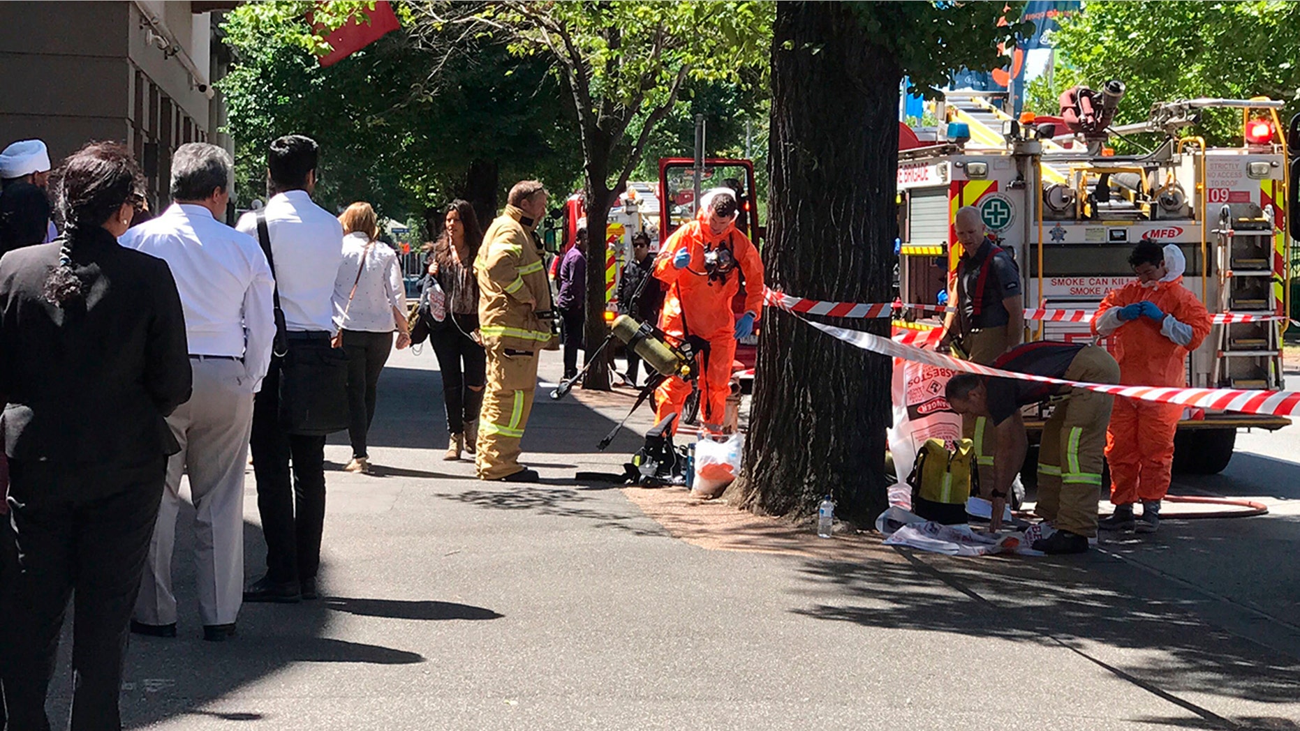 Hazmat and fire crews work outside the Indian and French Consulate in Melbourne, Australia, Wednesday, Jan. 9, 2019. (Associated Press)