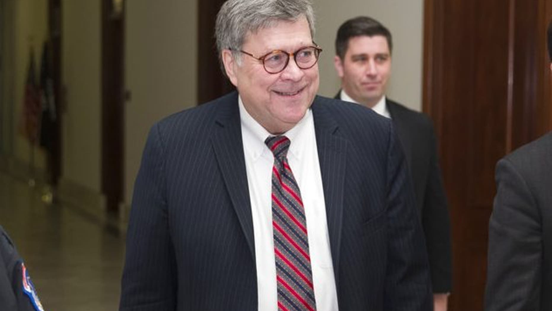 Attorney General nominee William Barr , center, arrives to meet with Sen. Ben Sasse, R-Neb., on Capitol Hill, Wednesday, Jan. 9, 2019 in Washington. (AP Photo/Alex Brandon)