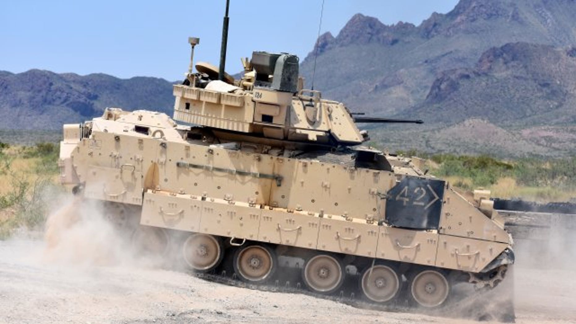 File photo - An M2A3 Bradley Fighting Vehicle crew changes position on the range during gunnery training at the Dona Ana Range Complex, N.M., Aug. 3, 2018. (Photo Credit: U.S. Army photo by Winifred Brown)