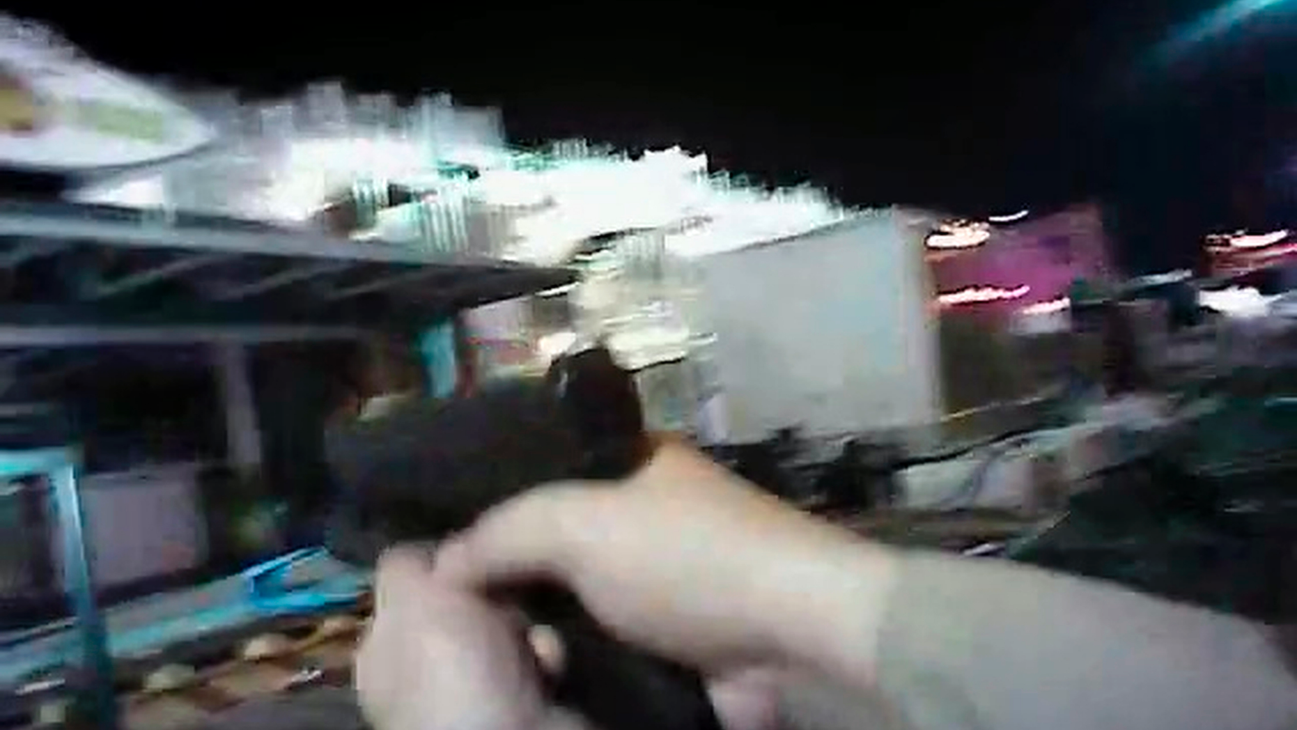 FILE - In this Sunday, Oct. 1, 2017, file image taken from police body cam video released by the Las Vegas Metropolitan Police Department on July 25, 2018, an armed law enforcement official points his gun while searching for a shooter in Las Vegas. Police in Las Vegas said Thursday, Jan. 3, 2019, they have finished releasing audio, video and written records about the investigation of the deadliest mass shooting in modern U.S. history. (Las Vegas Metropolitan Police Department via AP, File)