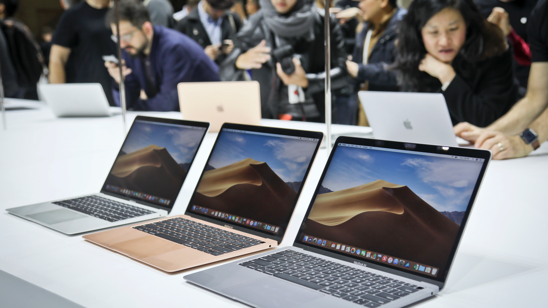 FILE- In this Oct. 30, 2018, file photo Apple's new MacBook Air computers are displayed during the company's showcase of new products in the Brooklyn borough of New York. Apple Inc. reports earnings Tuesday, Jan. 29, 2019. (AP Photo/Bebeto Matthews, File)