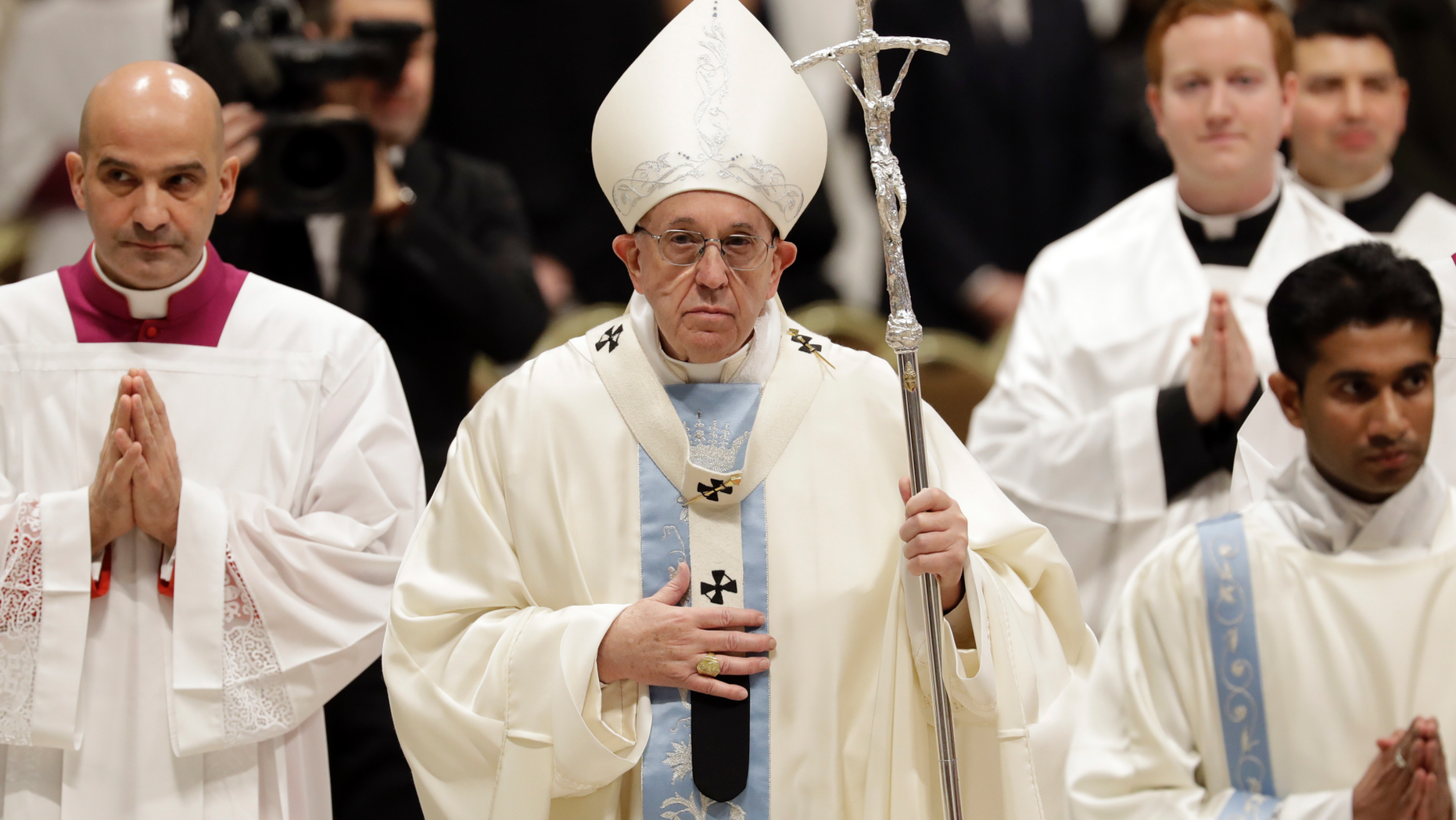 Pope Francis leaves after celebrating a new year Mass in St. Peter's Basilica at the Vatican, Tuesday, Jan. 1, 2019. Francis celebrated Mass Tuesday in St. Peter's Basilica to formally open 2019. In his homily Francis urged Catholics to allow themselves to be led again as children are led by their mothers. (AP Photo/Andrew Medichini)