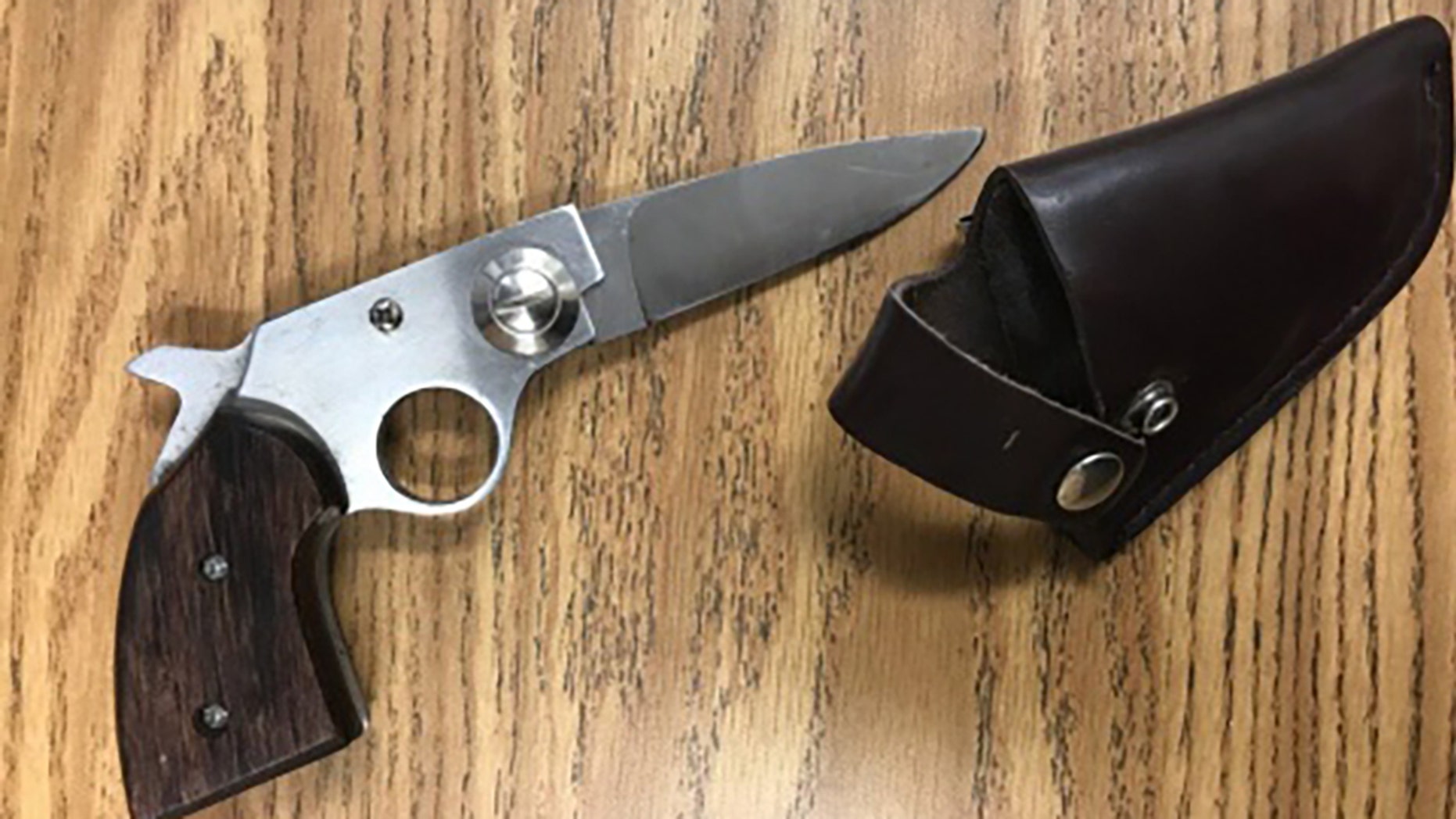 A Florida high school student brandished a gun-shaped knife during a fight, police say.