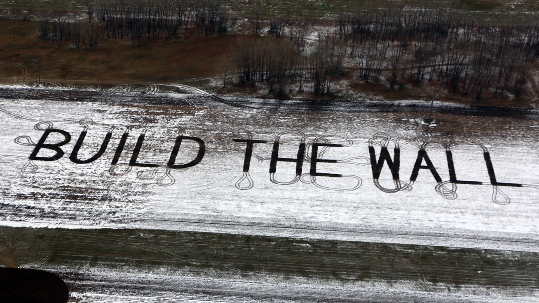 Farmer Gene Hanson of Edgeley, North Dakota plowed a message of support for President Trump: "Build the wall."