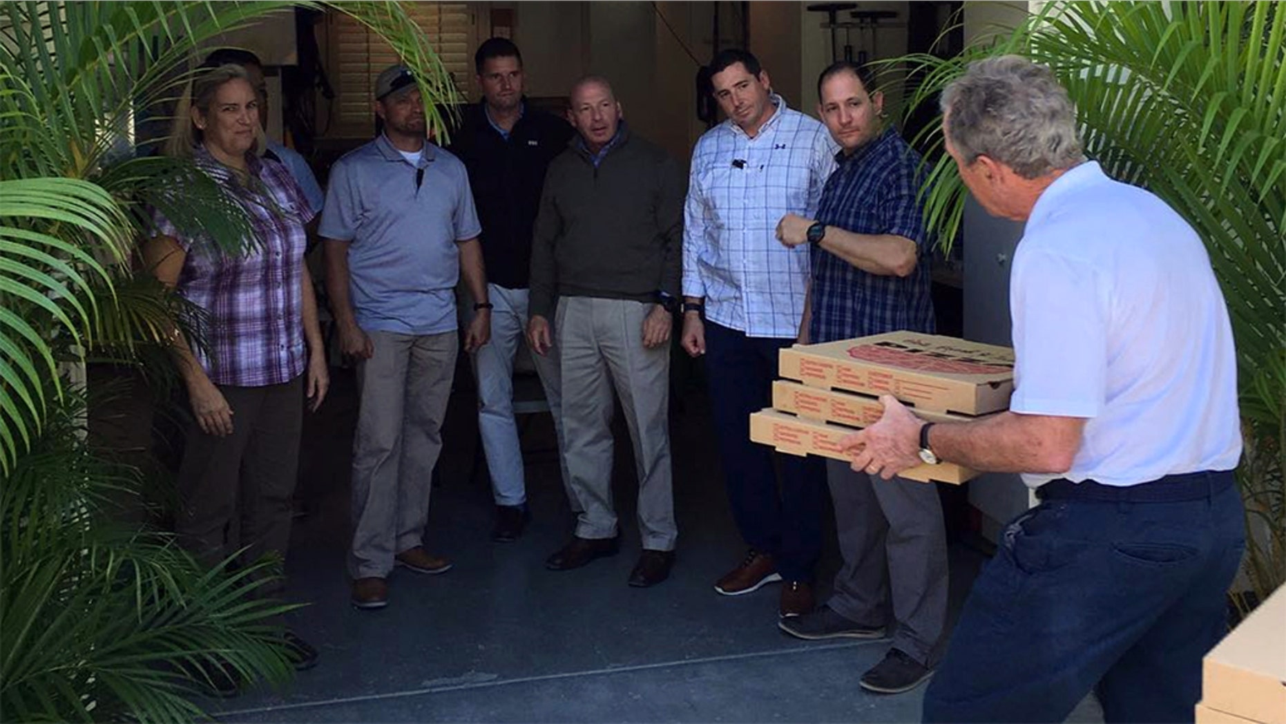 Former President George W. Bush posted a picture to his instagram account on Friday, delivering pizzas to Secret Service personnel.