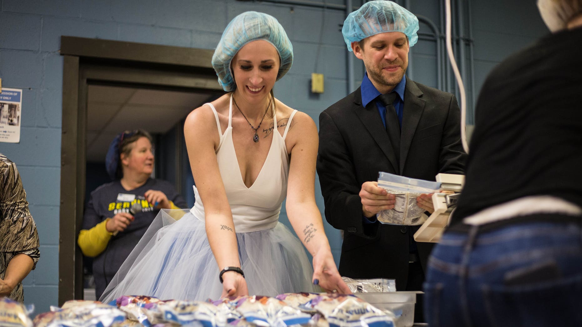 Minnesota couple prepares meals for hungry children after wedding: report