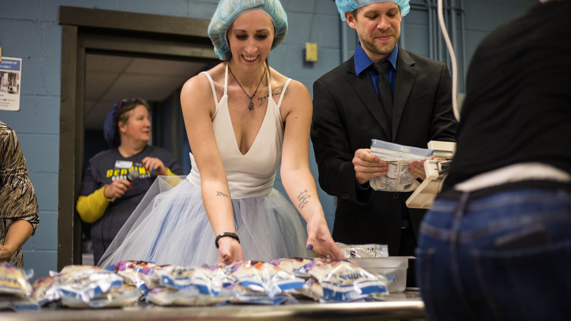 A Minnesota couple decided to say “I do” and kick off their future together at a space where they could also give back to hungry children.
