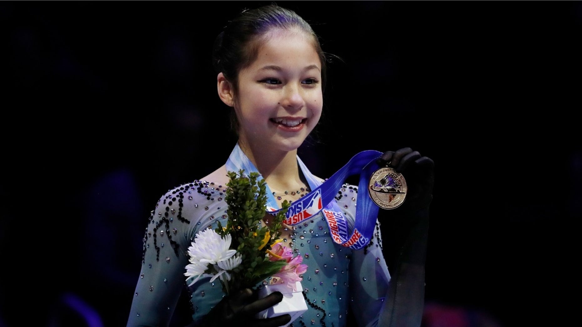 Alysa Liu holds her metal after winning the women’s title during the U.S. Figure Skating Championships on Friday, Jan. 25, 2019.