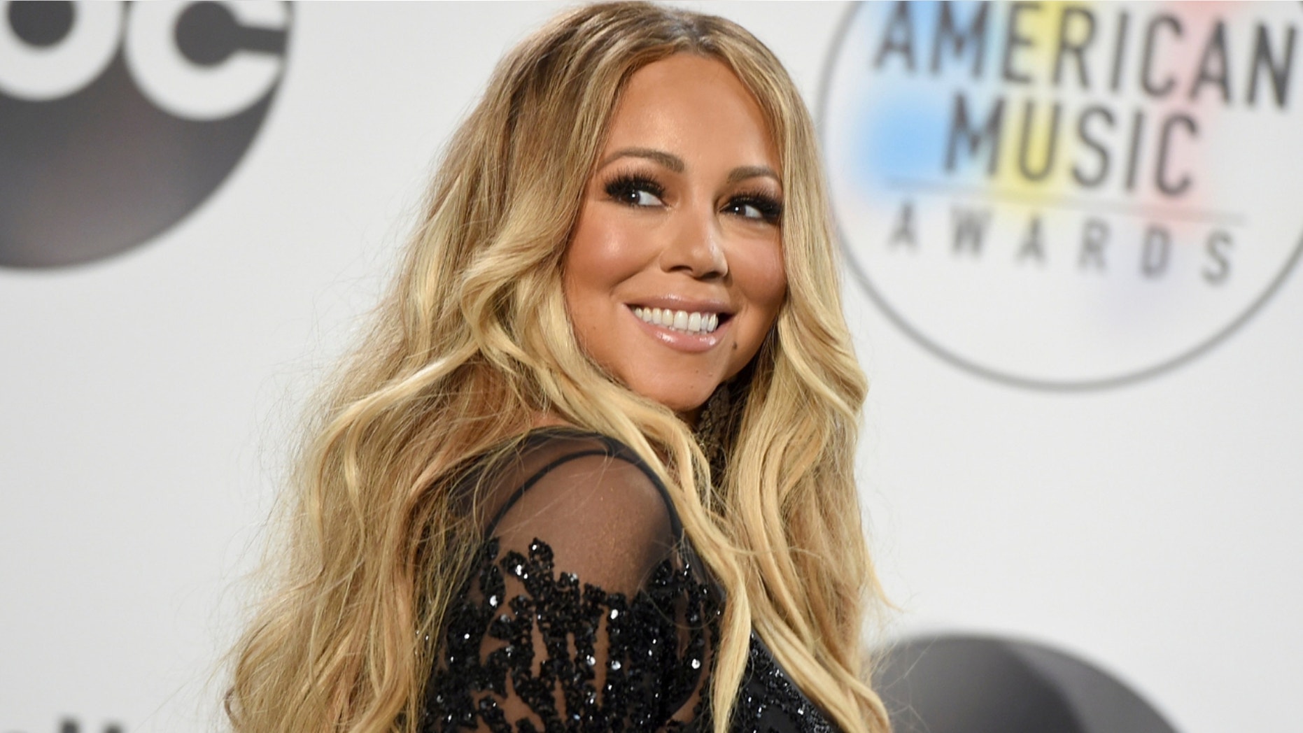 Singer Mariah Carey stunned in a sparkling string bikini.