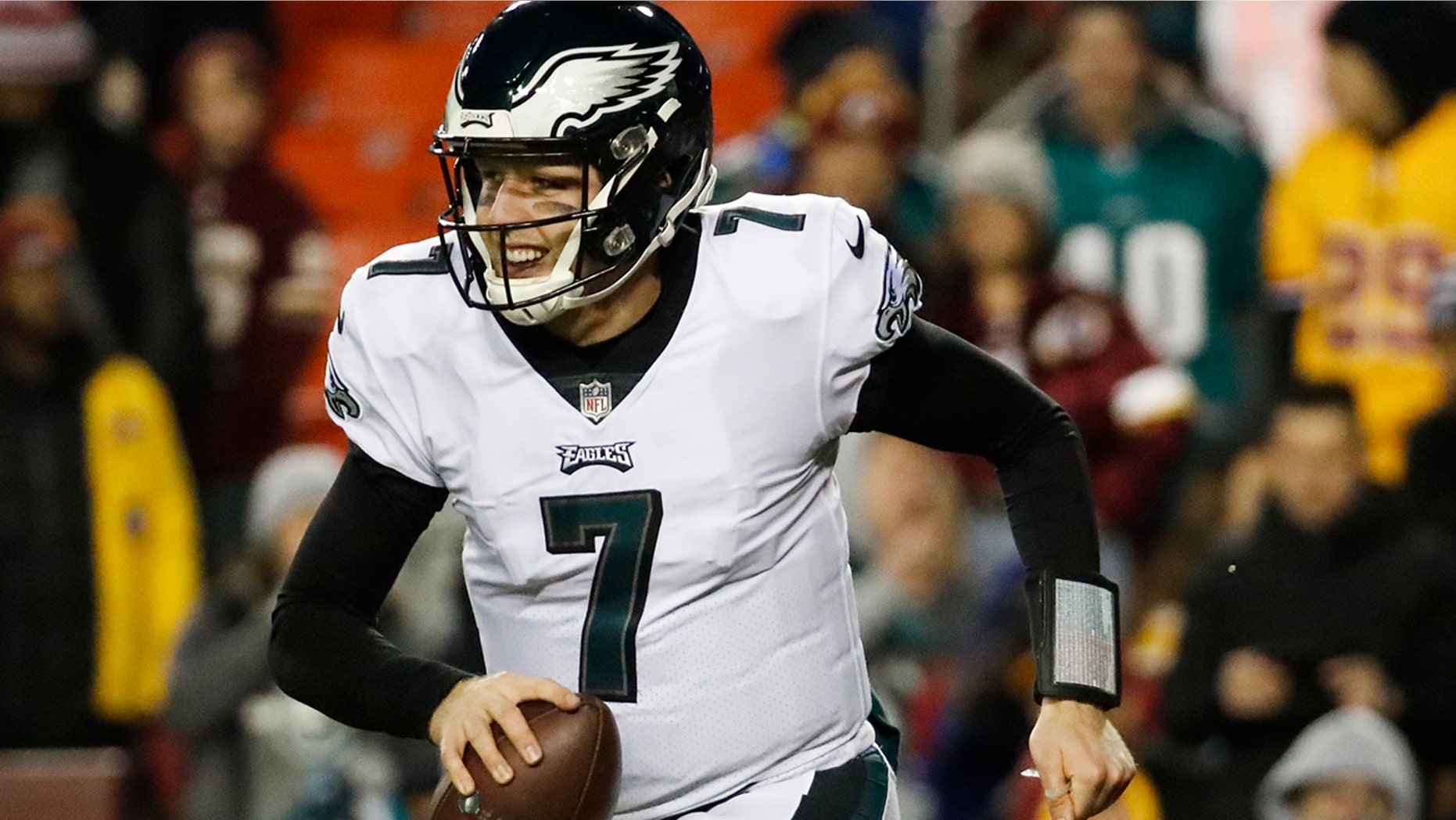 Philadelphia Eagles quarterback Nate Sudfeld (7) runs off the field with the ball after wide receiver Nelson Agholor's touchdown during the second half of the NFL football game against the Washington Redskins.