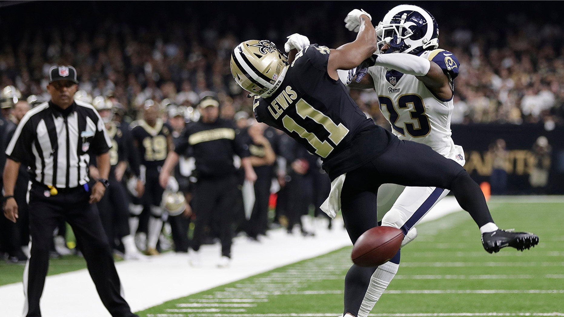 New Orleans Saints wide receiver Tommylee Lewis (11) works for a catch against Los Angeles Rams defensive back Nickell Robey-Coleman (23) during the second half the NFC Championship Game, Jan. 20, 2019, in New Orleans. The Rams won 26-23. (Associated Press)