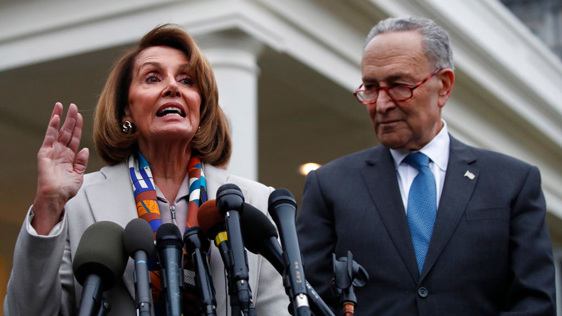 House Democratic leader Nancy Pelosi of California, left, the House Speaker-designate, and Senate Minority Leader Chuck Schumer, D-N.Y., speak to the media after meeting with President Donald Trump, Wednesday, Jan. 2, 2019, on border security at the White House in Washington. (AP Photo/Jacquelyn Martin)