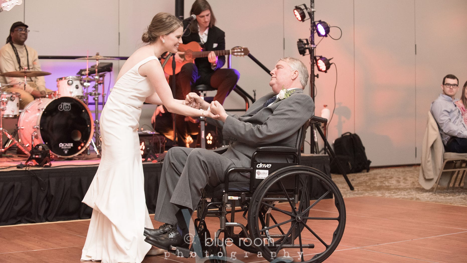 Mary Bourne Butts (née Roberts) dances with her father Jim. (Blue Room Photography)