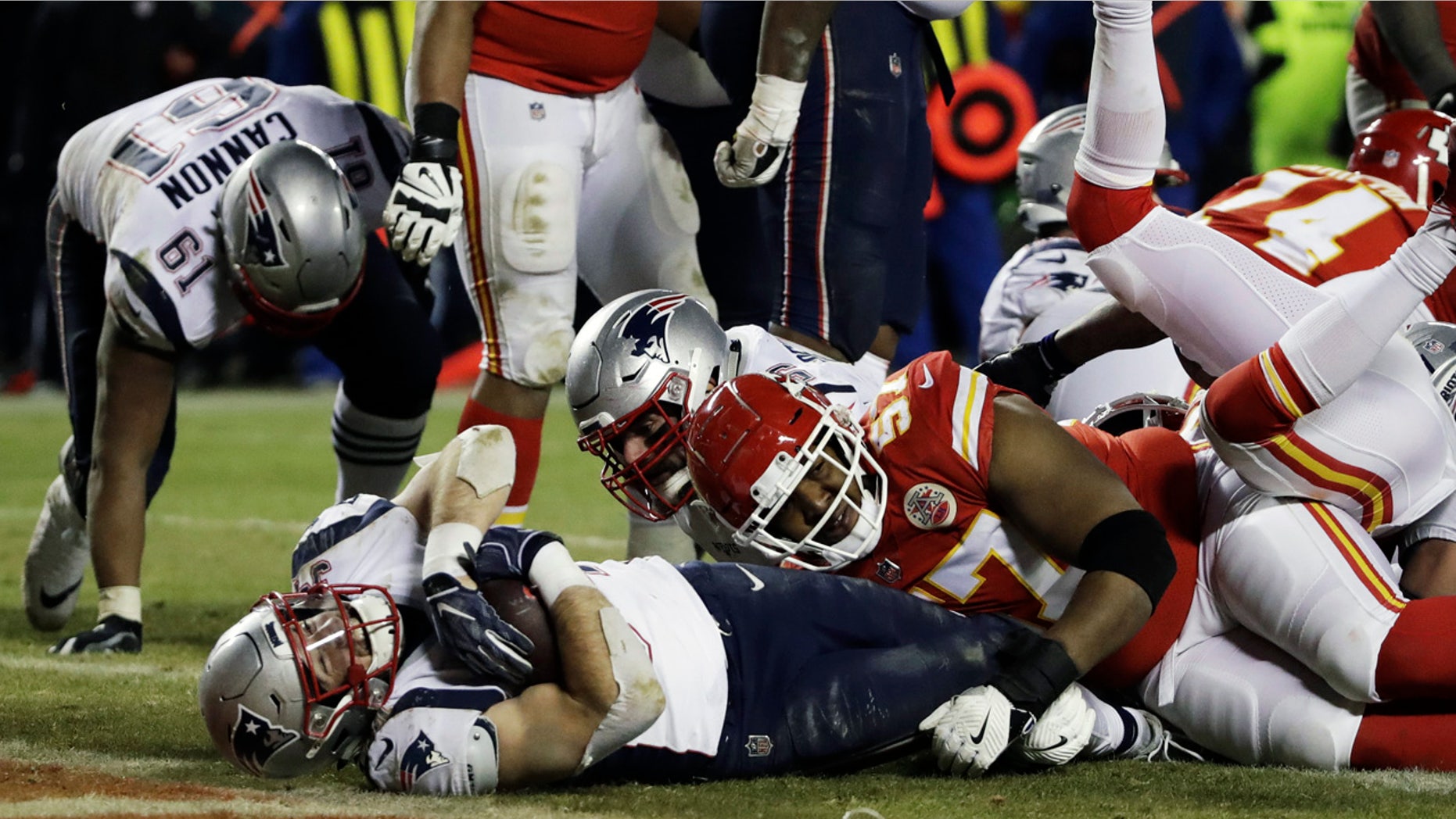 Rex Burkhead goes in for the winning score in overtime. (AP Photo/Elise Amendola)